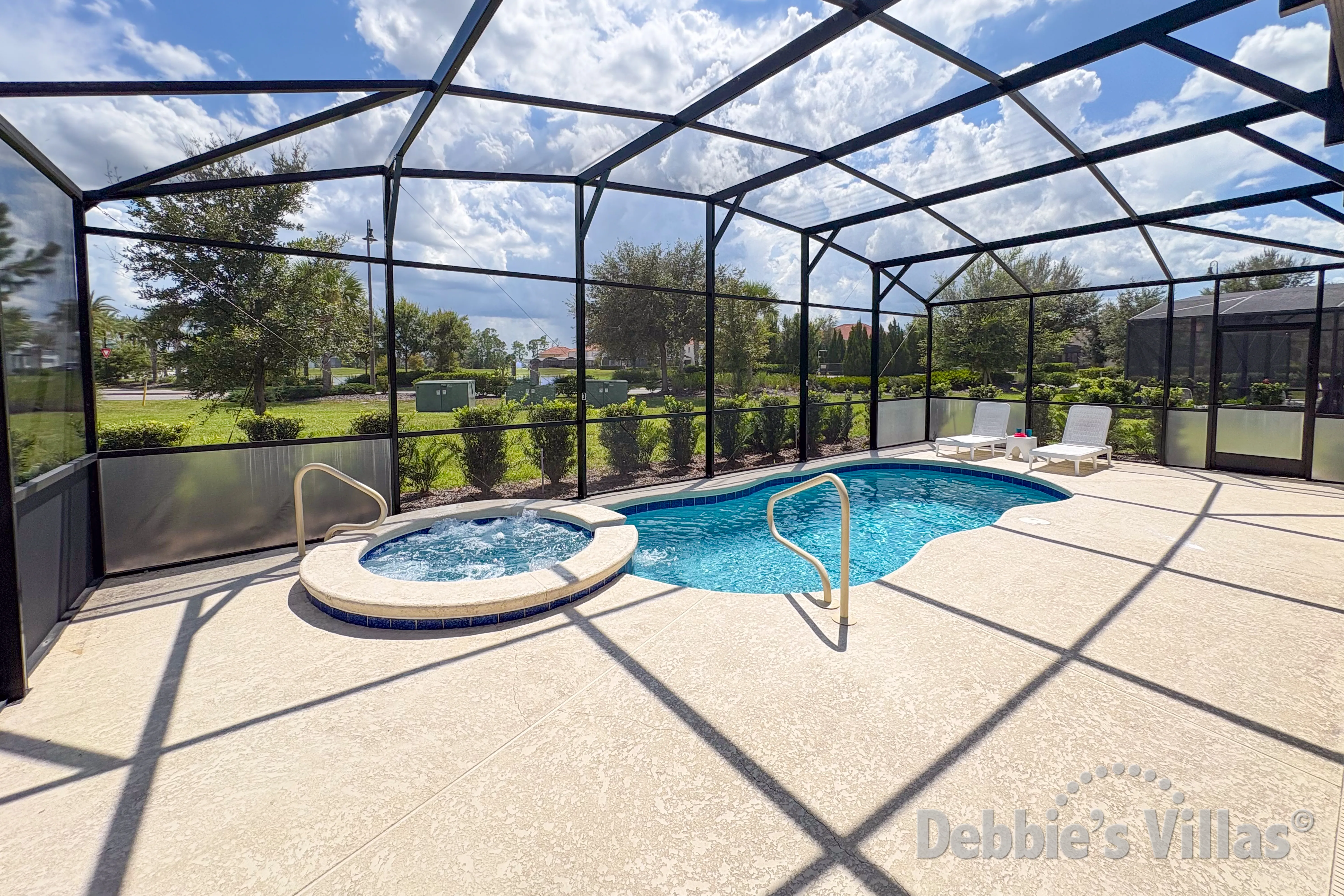 South-facing pool and spa at this vacation villa on Solterra in Davenport