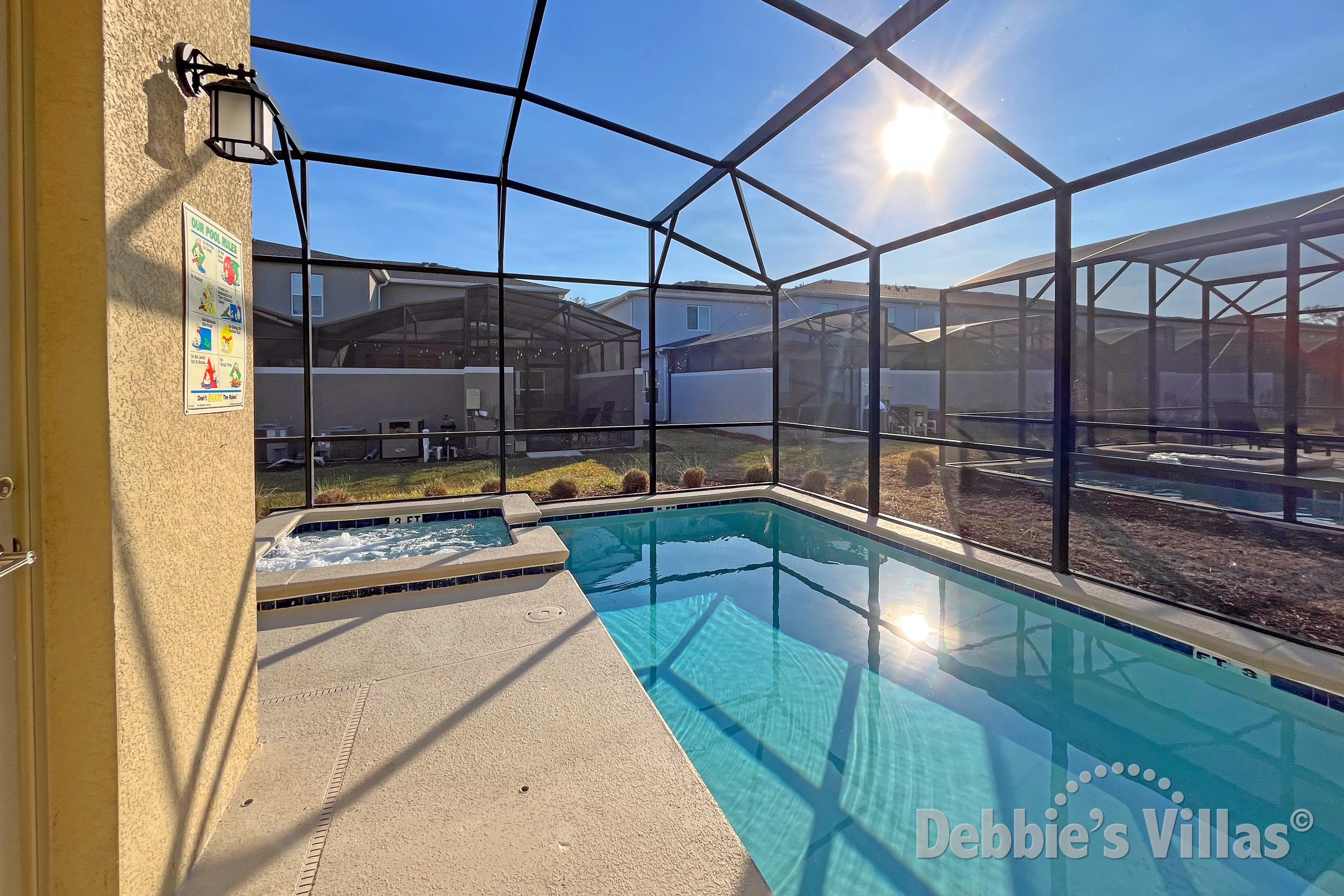 South-facing pool and spa at this vacation villa on Storey Lake in Kissimmee
