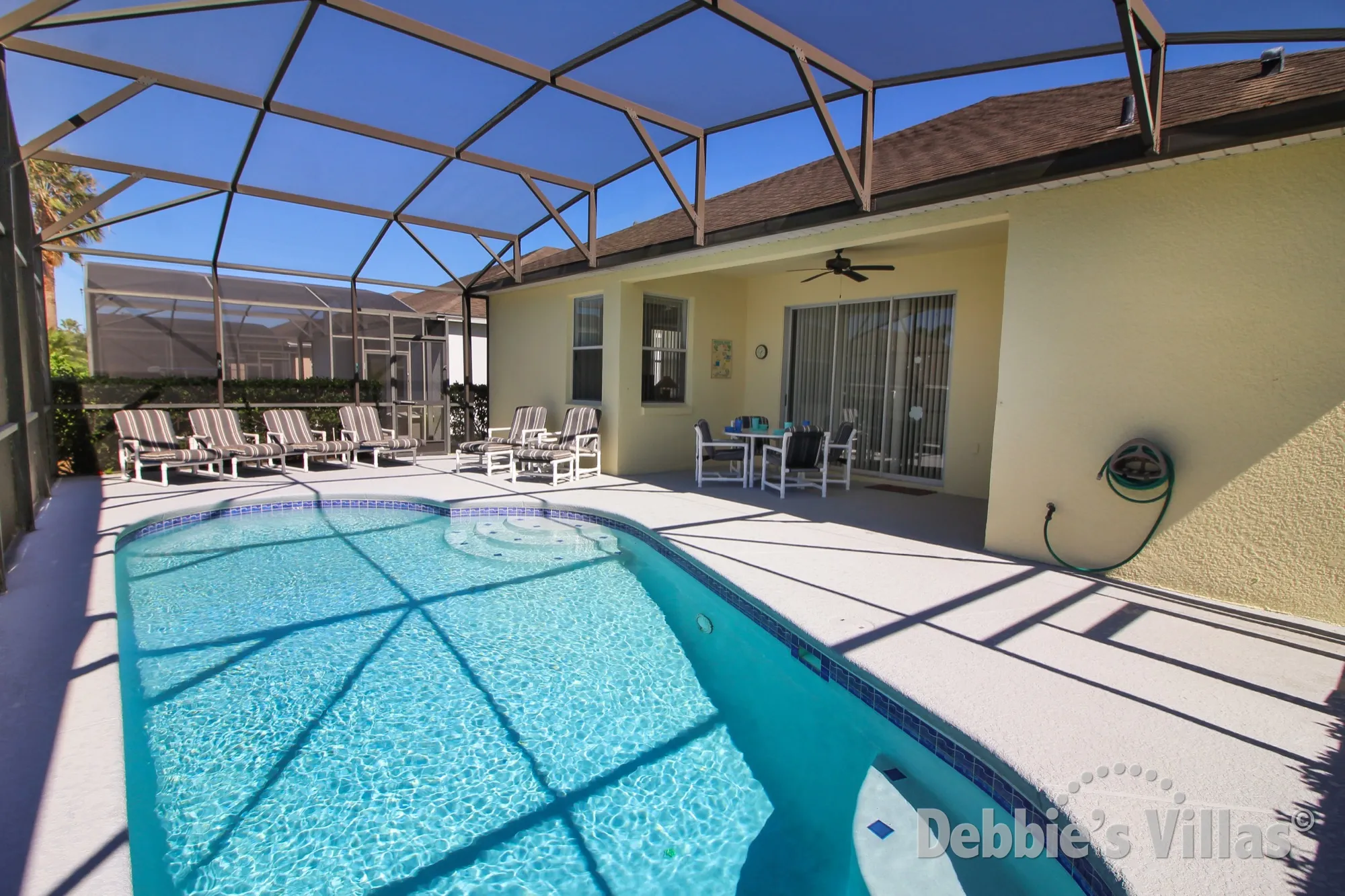 Sunny west-facing pool deck on Calabay Parc in Davenport