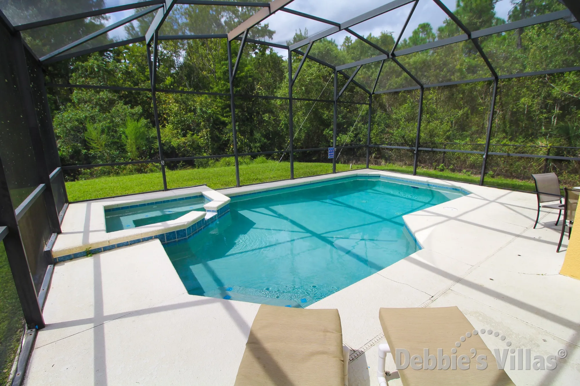 West-facing pool and spa with conservation view at this private villa on Sandy Ridge in Davenport