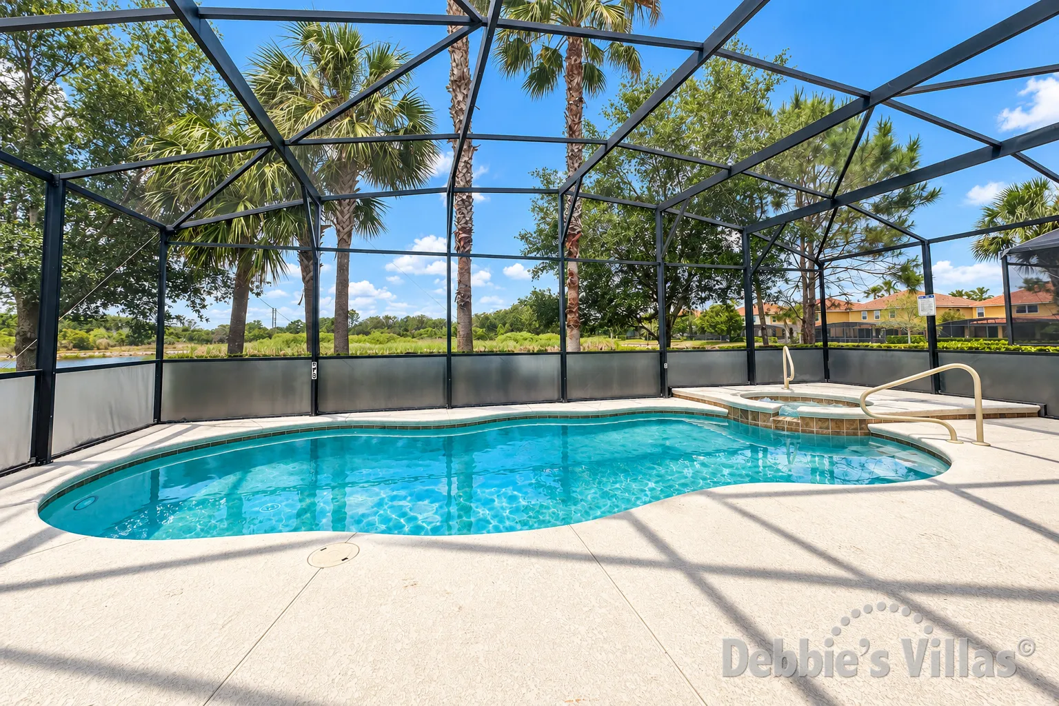 West-facing pool and spa at this vacation villa on Solterra in Davenport 