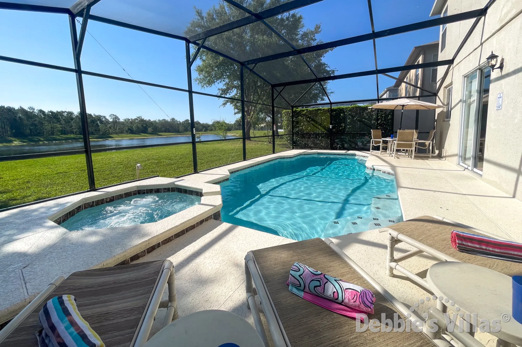 Stunning lake view from the secluded pool and spa deck at this Clermont vacation villa