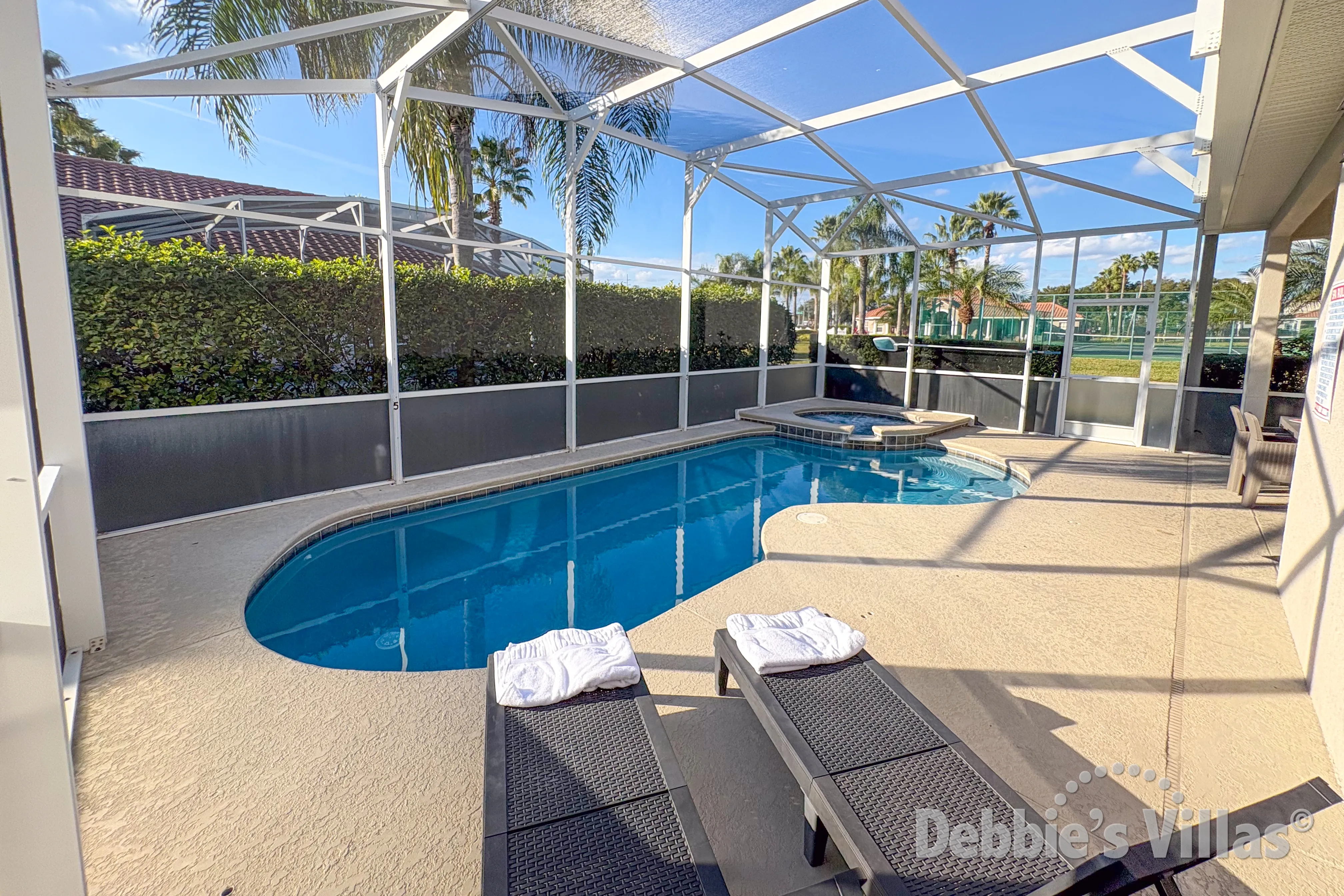 West-facing pool and spa at this courtyard villa on Tuscan Hills in Davenport