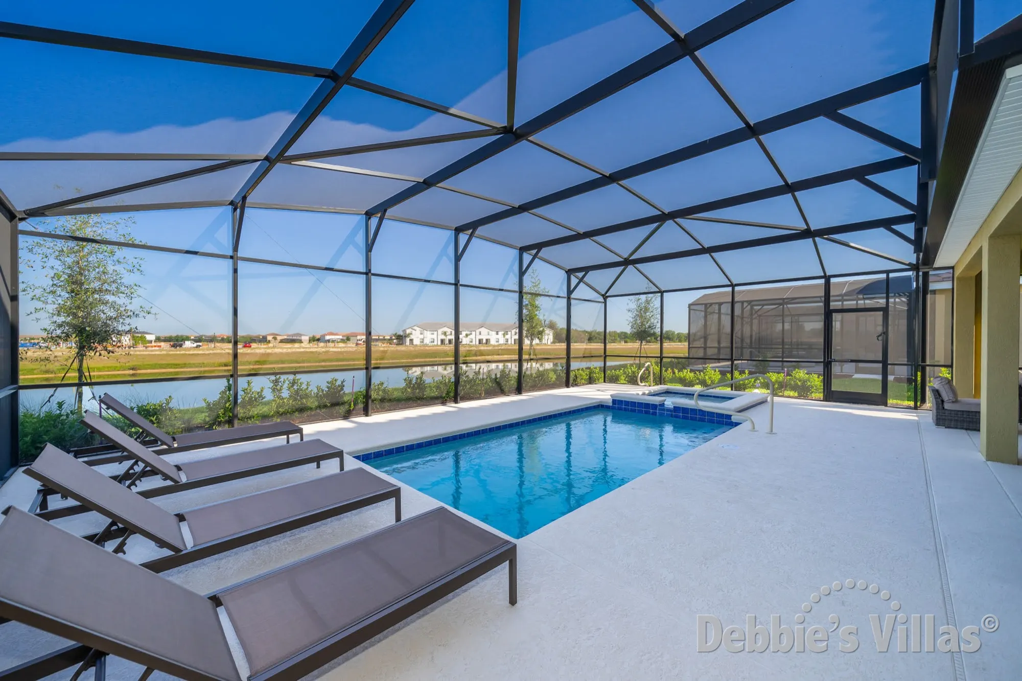 Lake view from the west-facing pool deck at this Solterra villa in Davenport