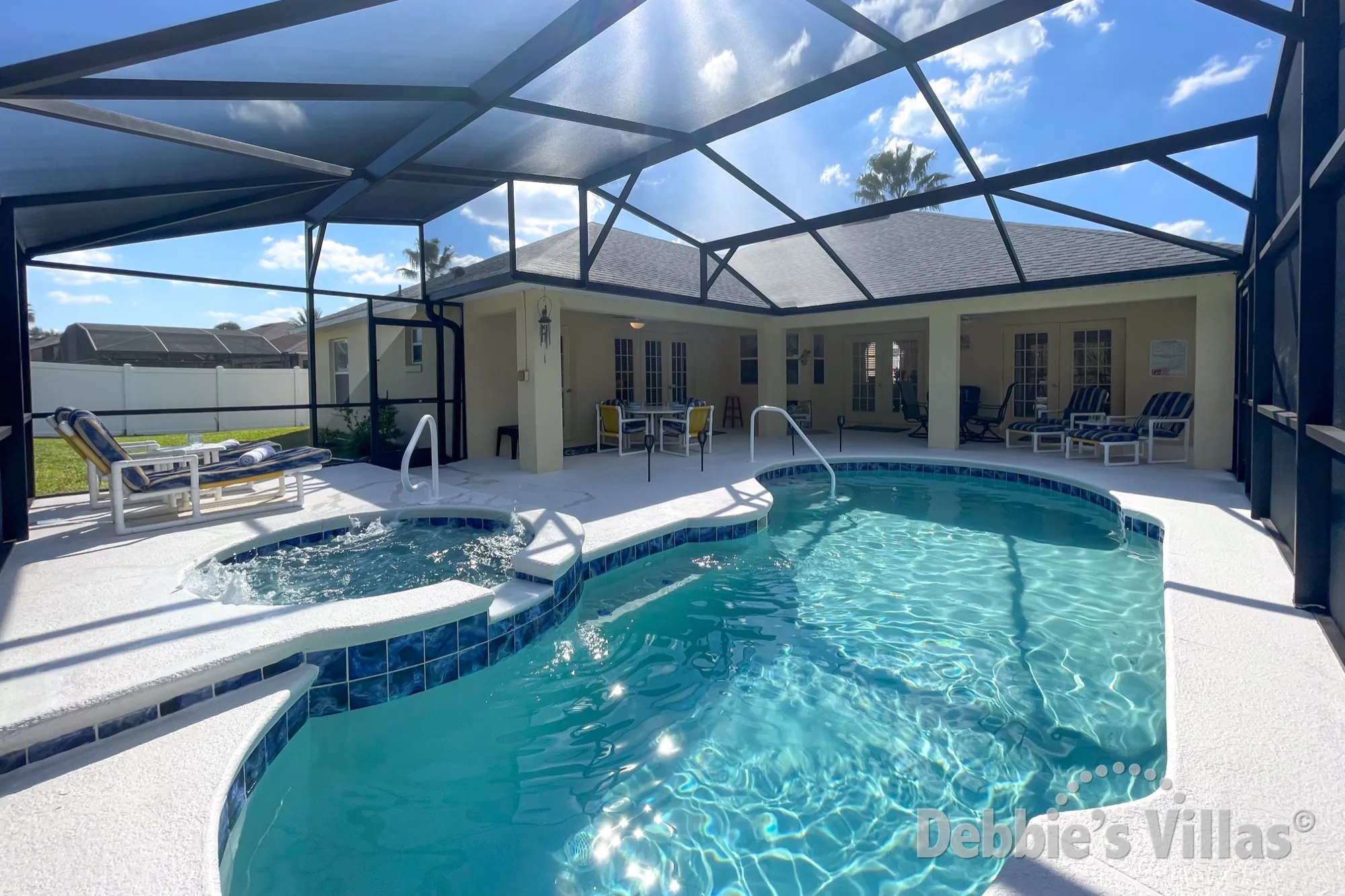 Sun-drenched secluded pool and spa deck at this Davenport vacation villa