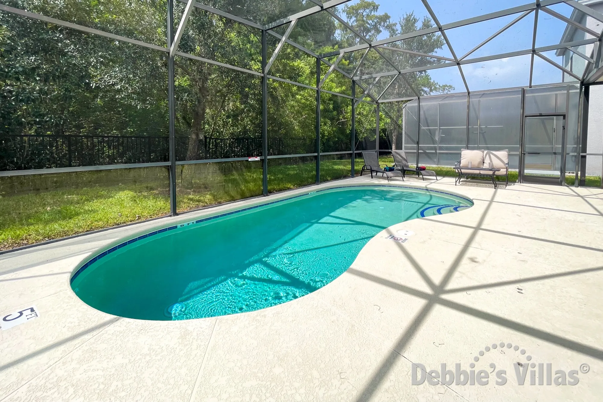 Sun-drenched west-facing pool deck at this Bella Vida vacation villa in Kissimmee