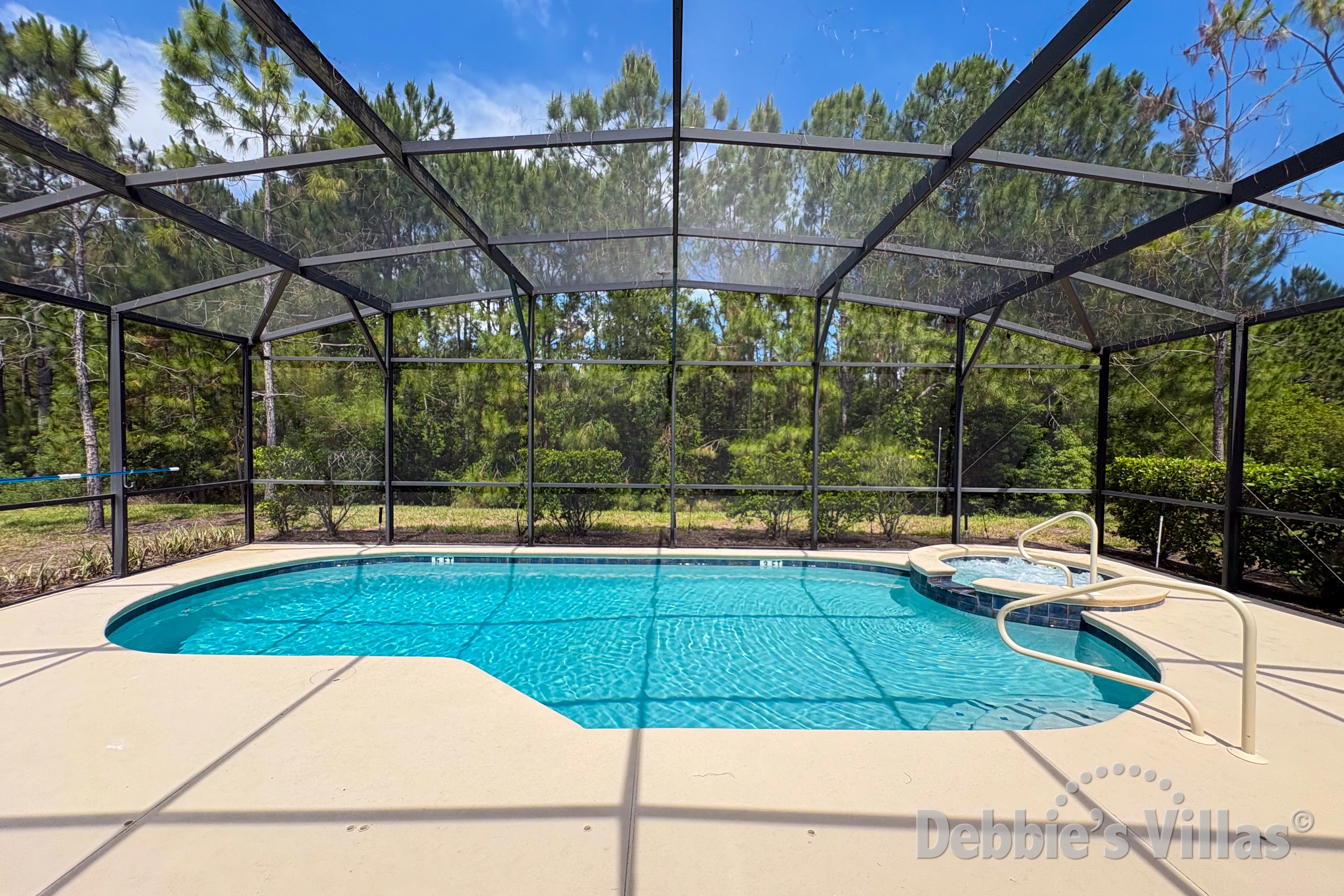 Pool and spa with conservation views at this vacation villa on Solterra in Davenport 