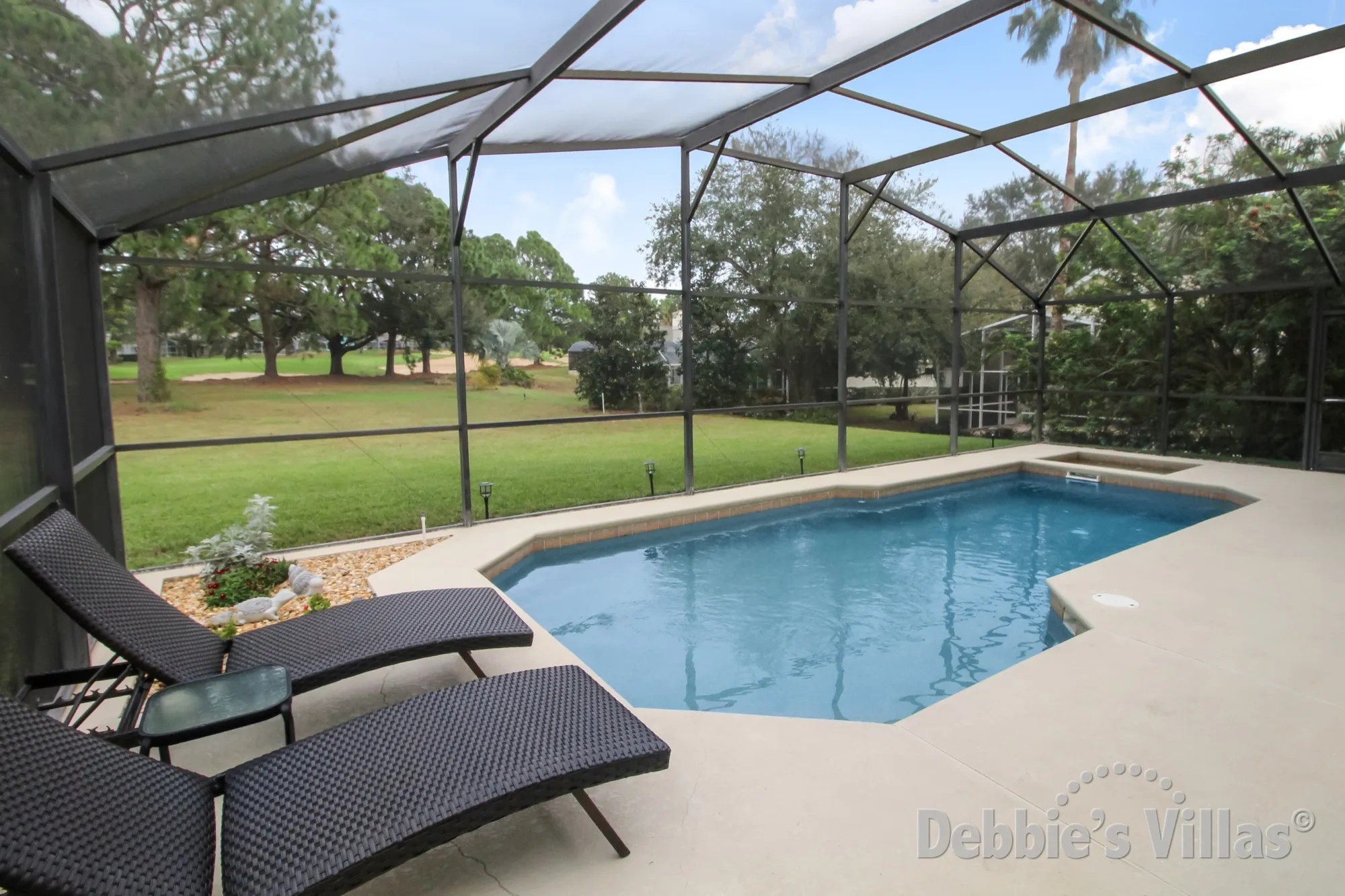 Golf course views from the pool deck of this Southern Dunes villa