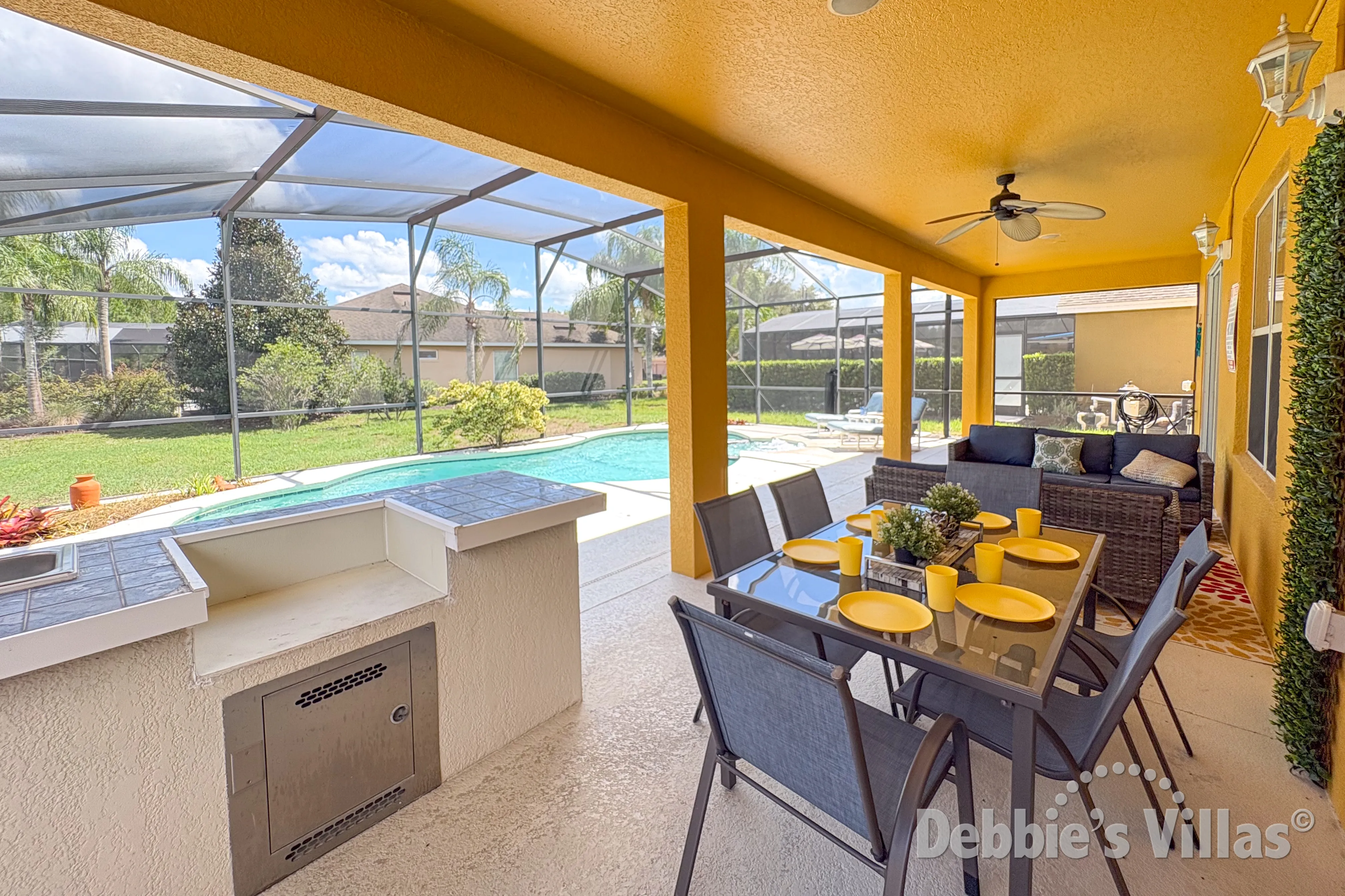 Enjoy an alfresco meal at the covered dining table at this Davenport vacation villa 