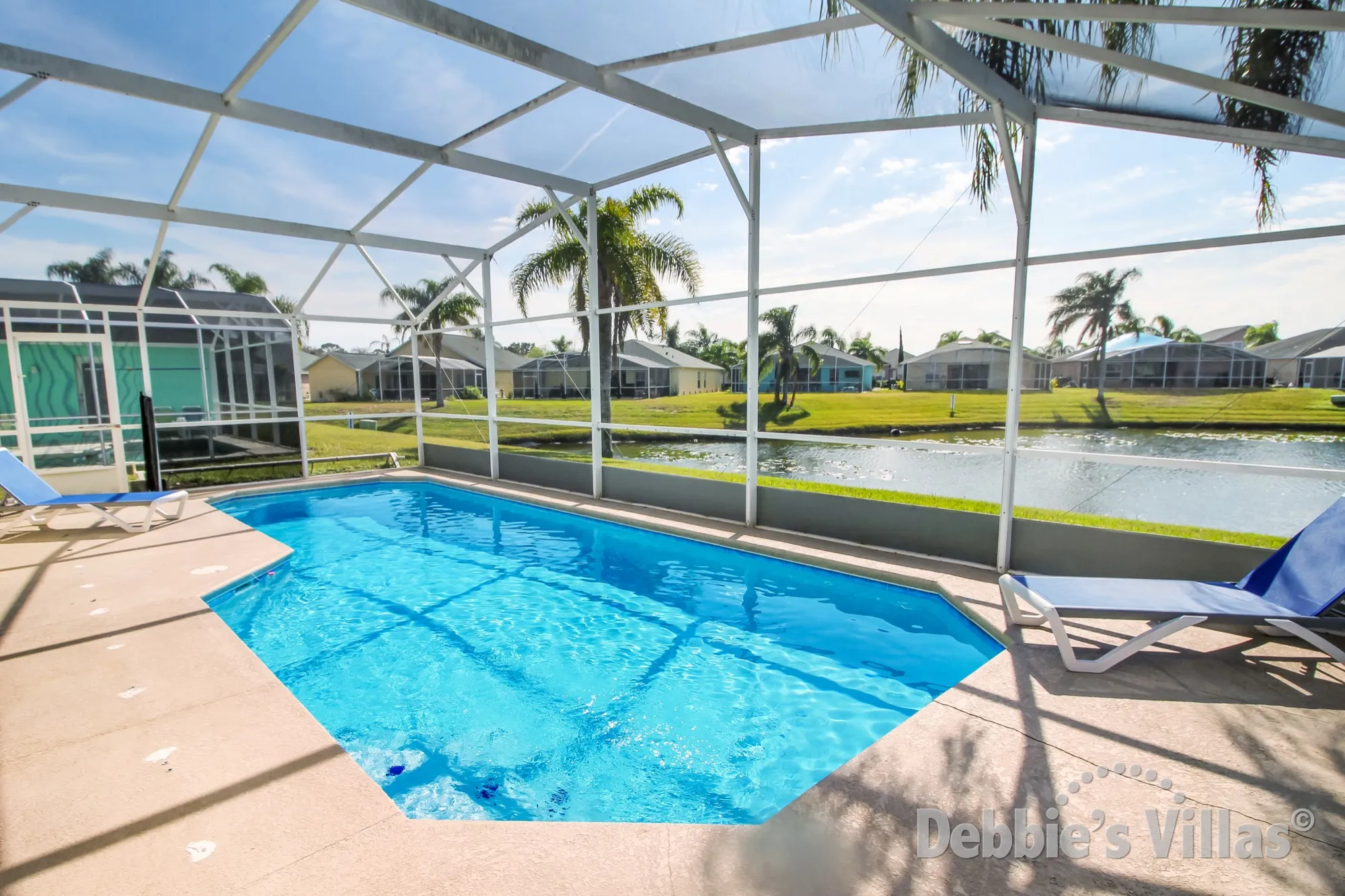 South-facing private pool with a lake view at this vacation villa in Davenport