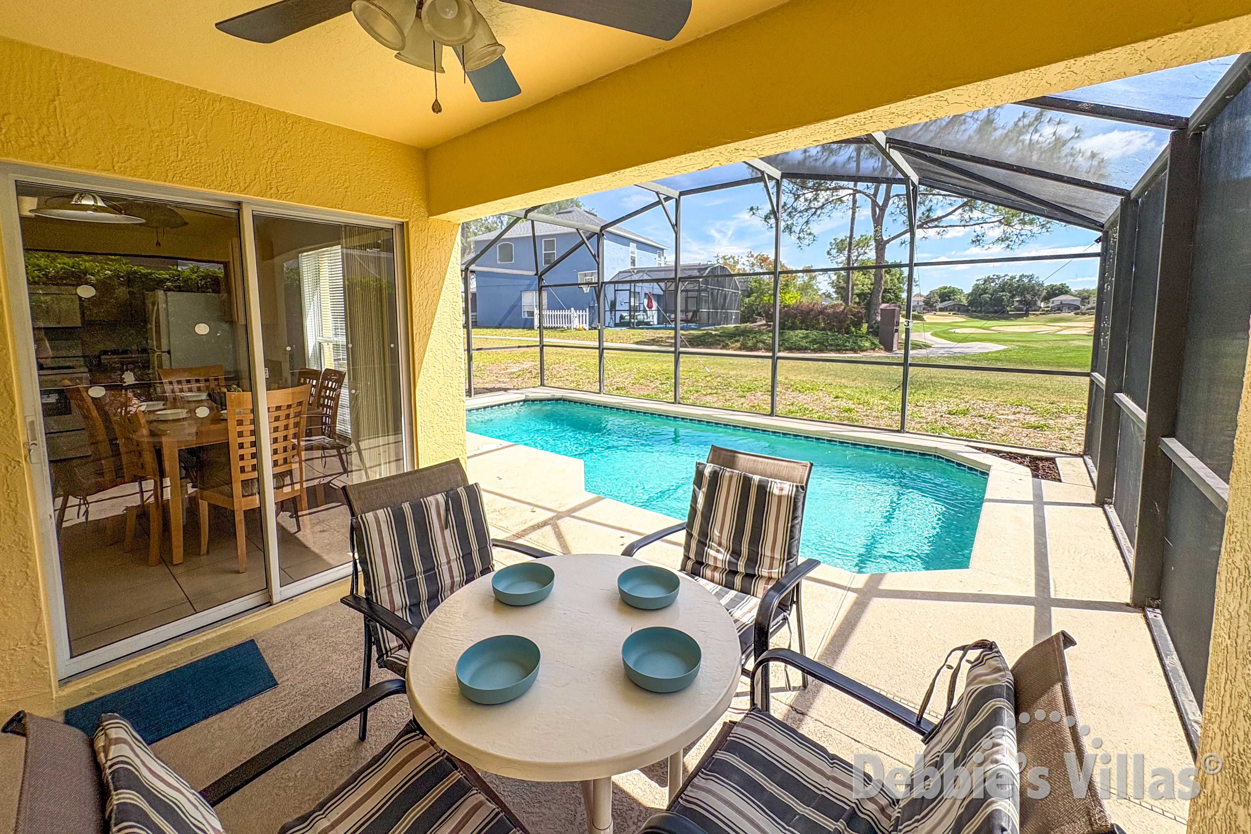Dine alfresco at the covered dining table at the south-facing pool 