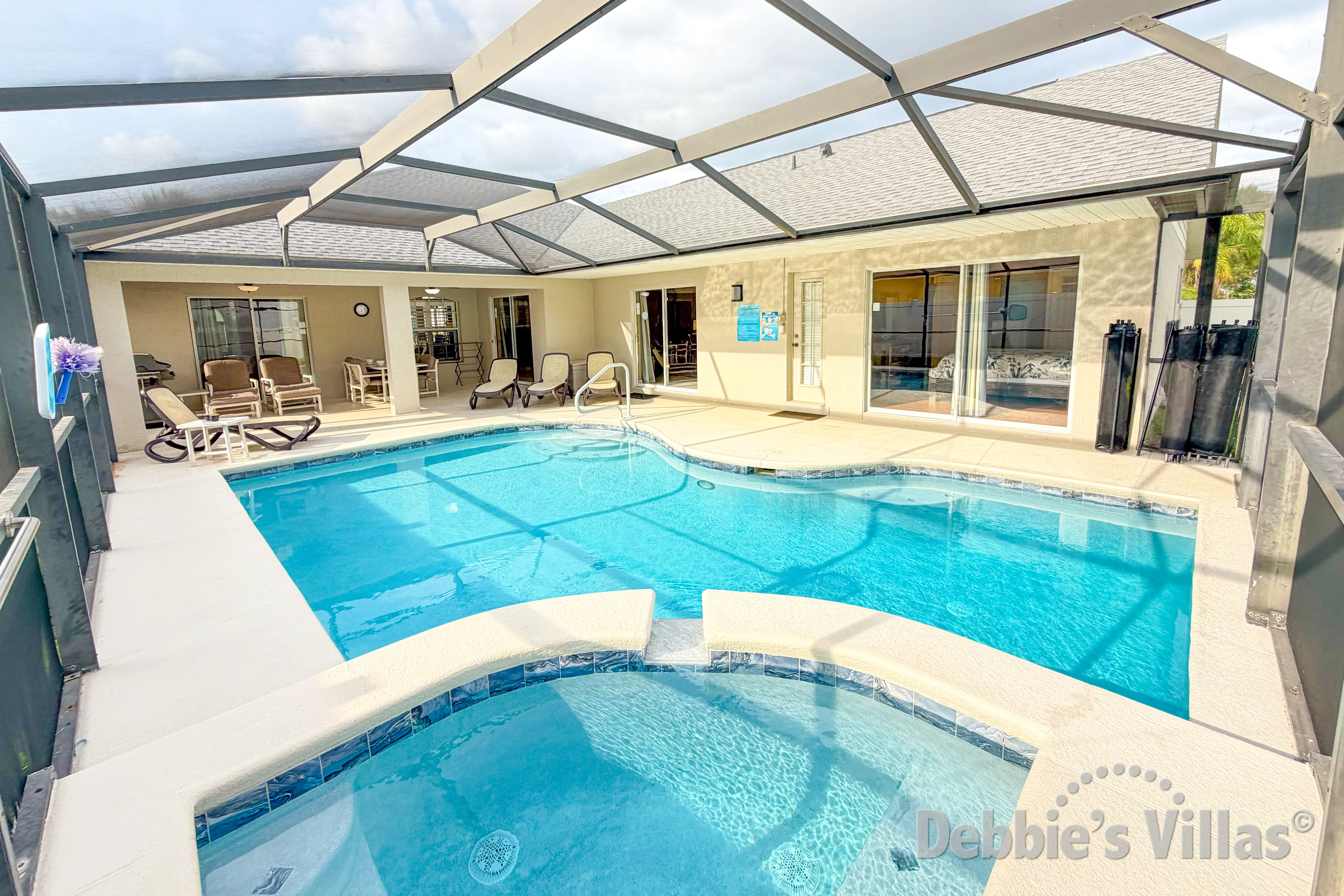 Enjoy a relaxing soak in the spa at this vacation villa on Orange Tree in Clermont 