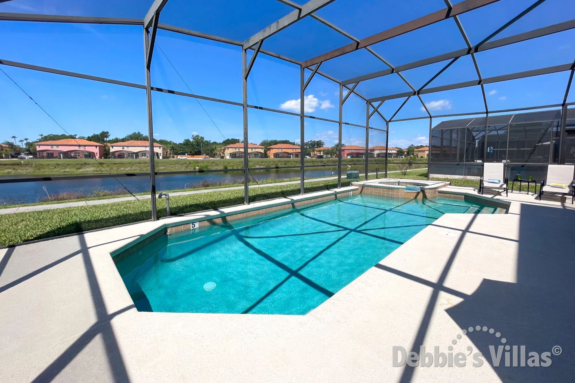 Sun-drenched, west-facing private pool and spa with a lake view at this Kissimmee vacation villa