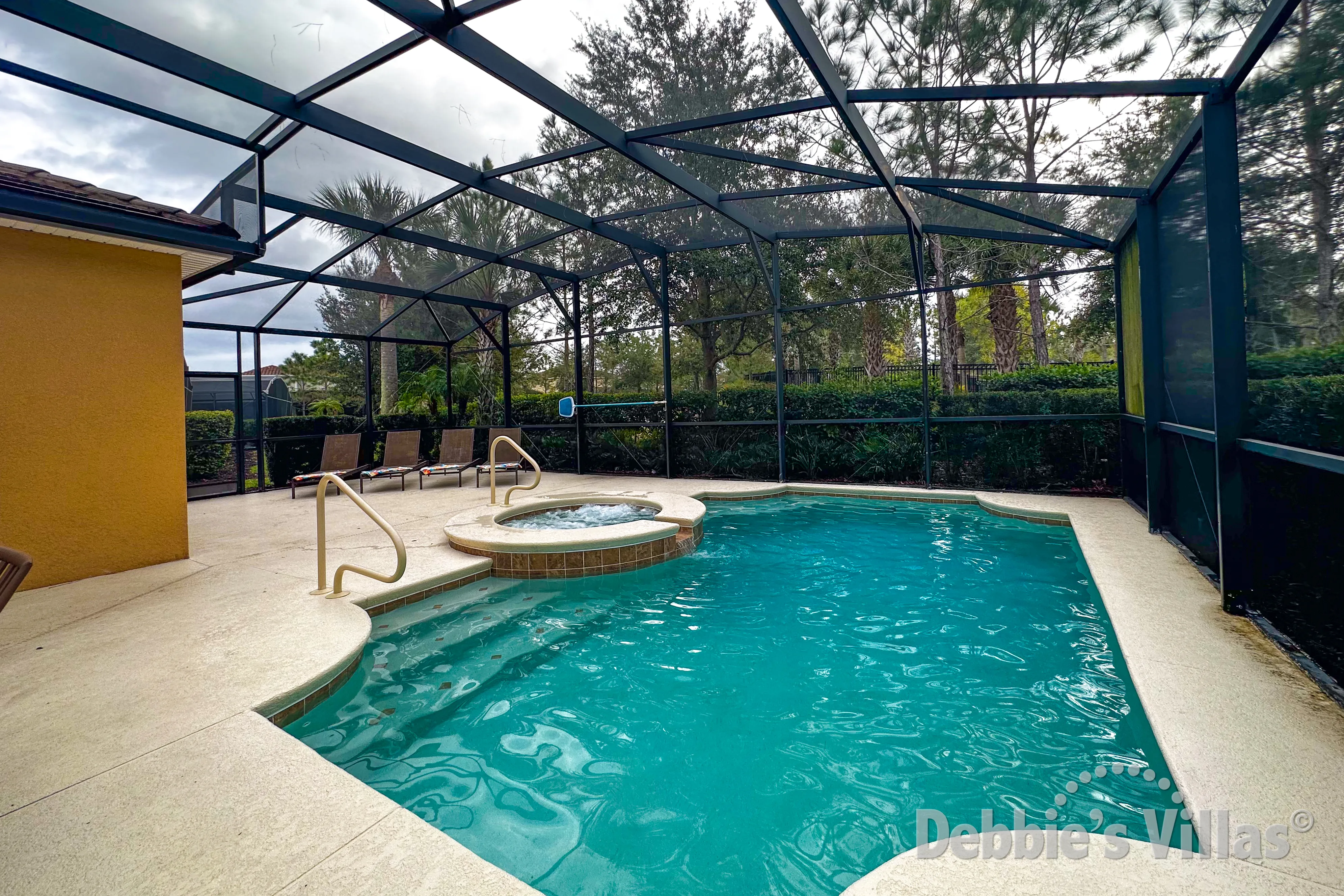 Southwest-facing pool and spa at this vacation villa on Solterra in Davenport