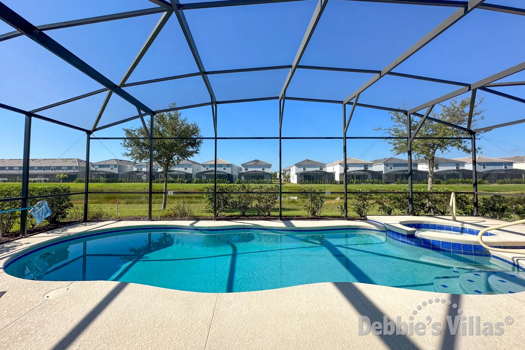 Stunning lake view from the south-facing pool deck at this Solterra vacation villa