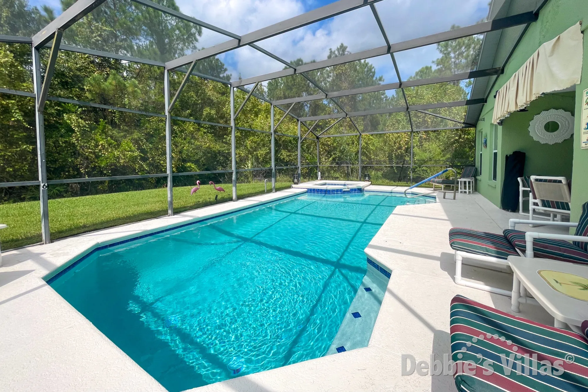 Gorgeous woodland view from the west-facing pool and spa deck at this Davenport vacation villa