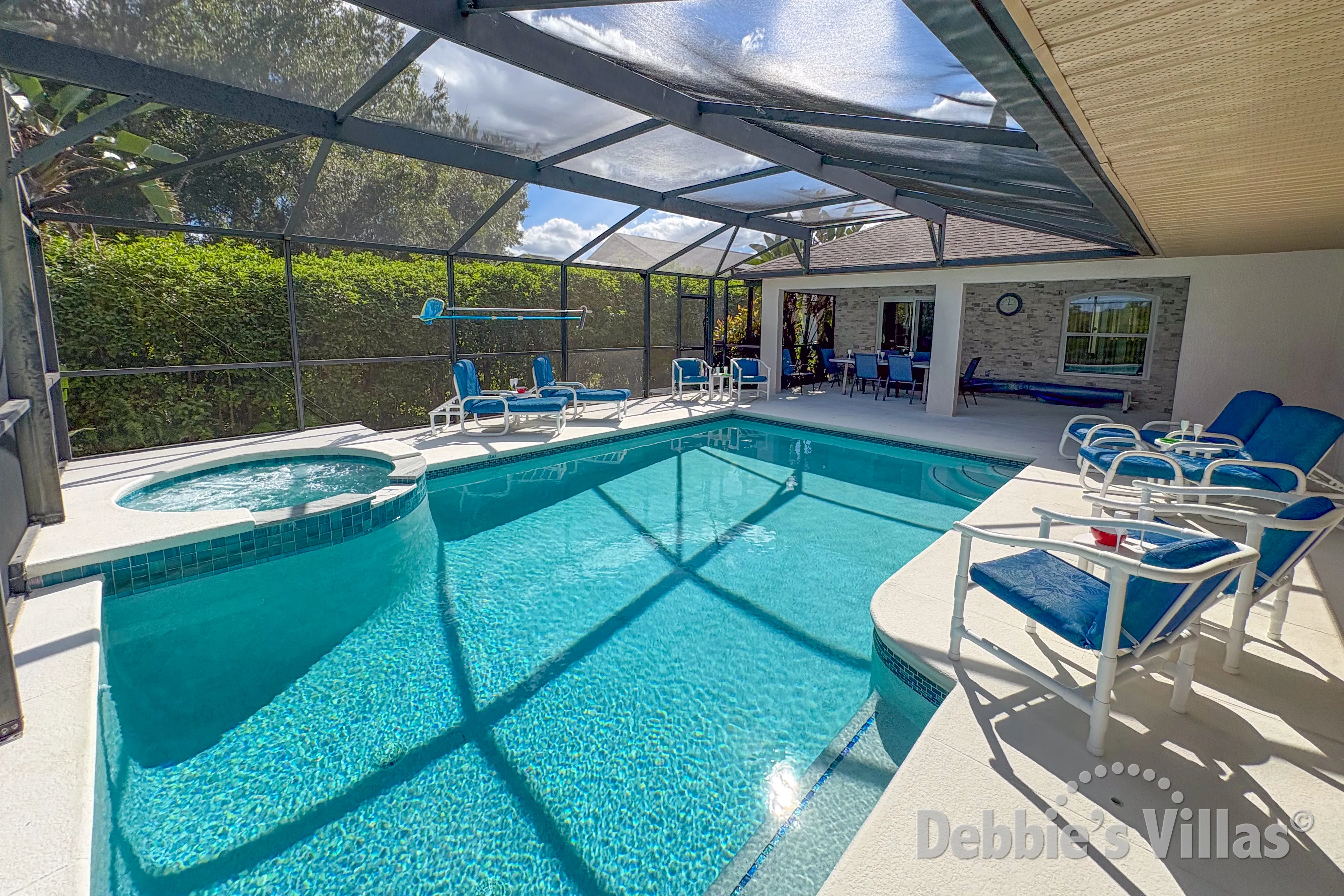 South and east-facing pool and spa at this vacation villa on Orange Tree in Clermont 