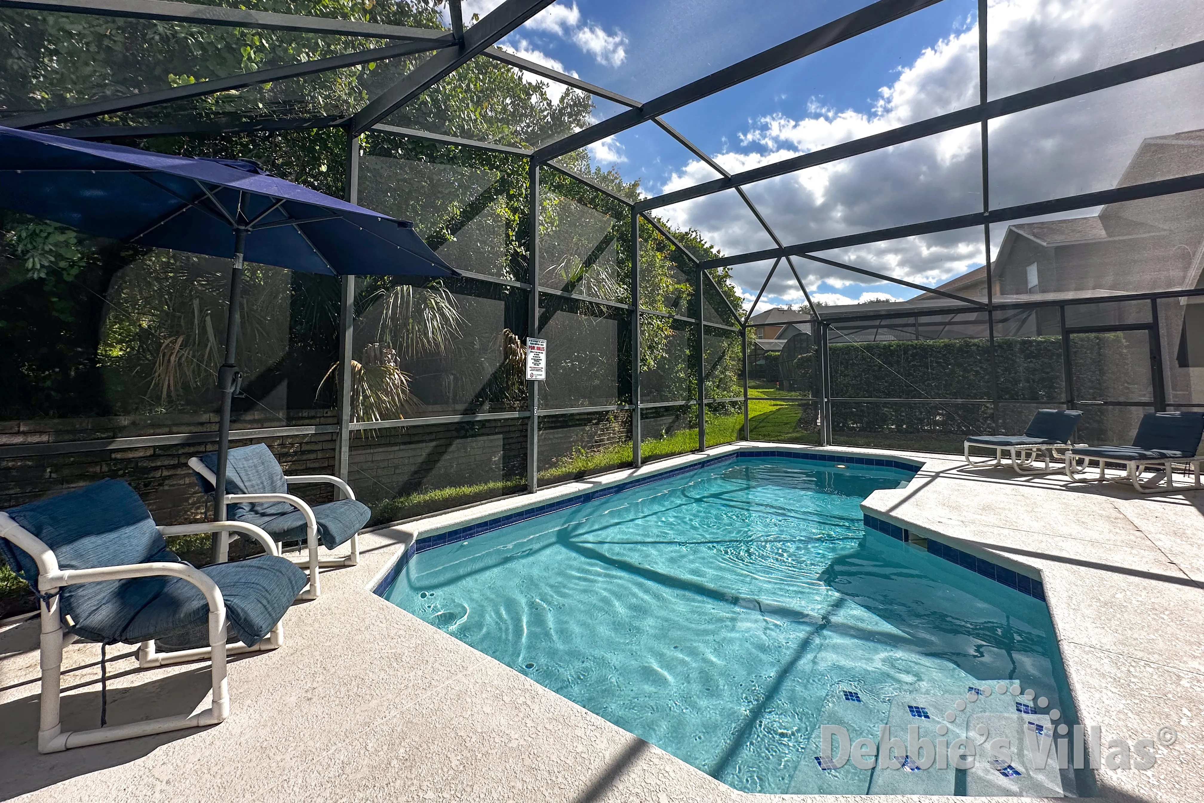 Sun-drenched south-facing pool deck at this Emerald Island vacation villa