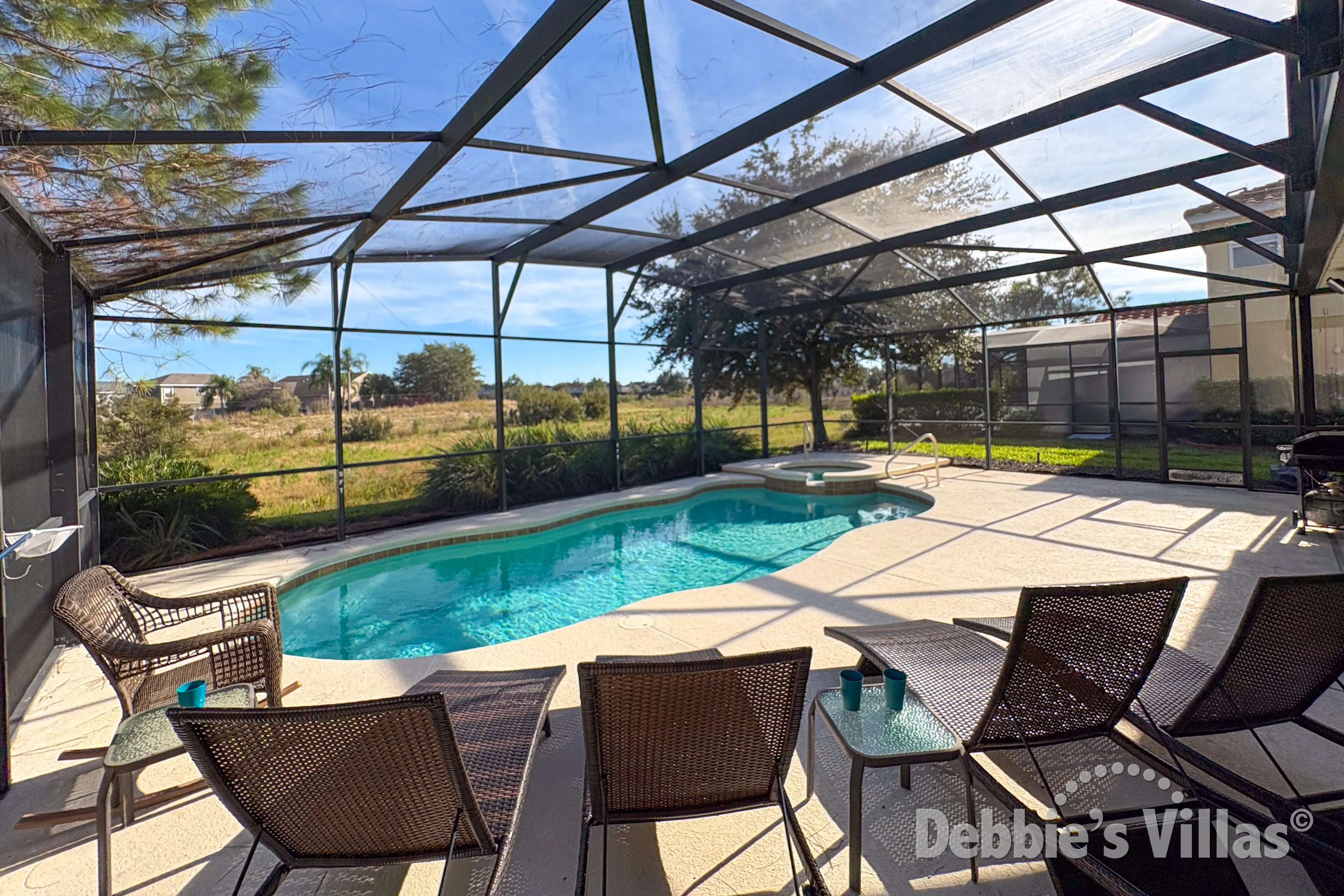 Southeast-facing pool and spa at this vacation villa on Solterra in Davenport 