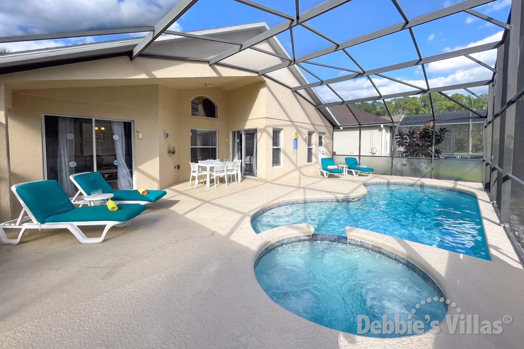 Sunny south-facing pool and spa deck at this Seasons vacation villa