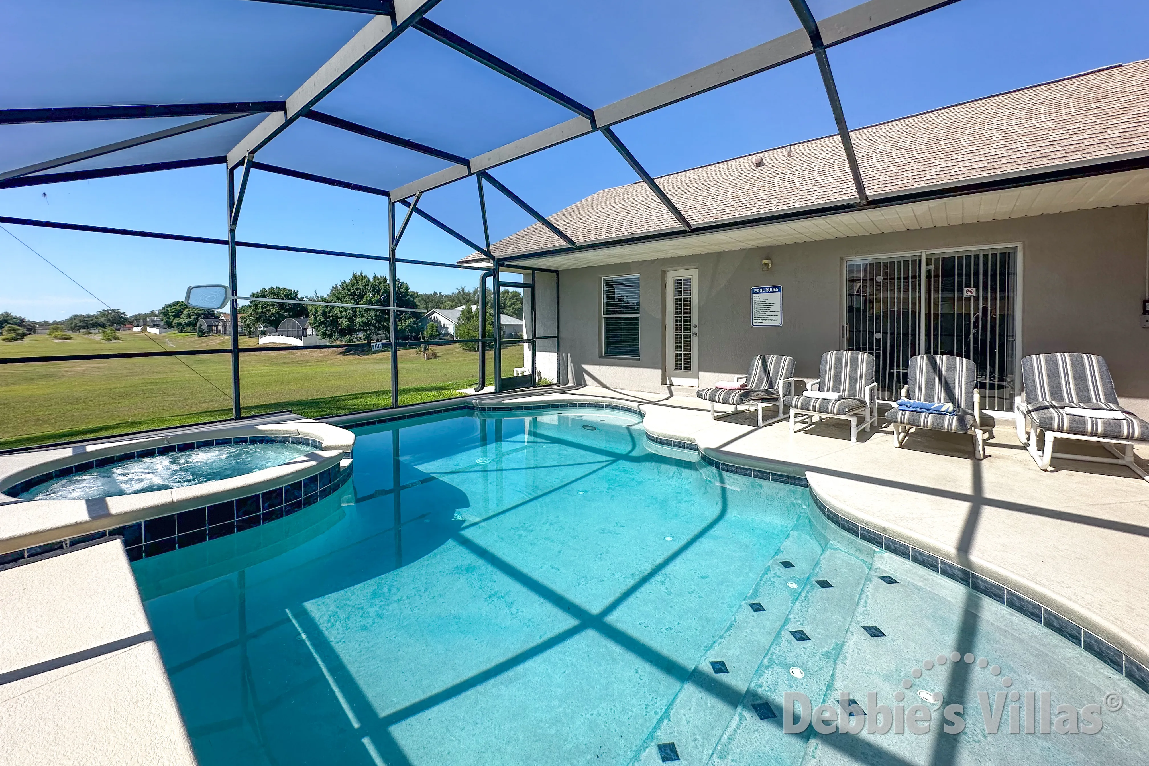 Southeast-facing pool and spa at this vacation villa on Orange Tree in Clermont