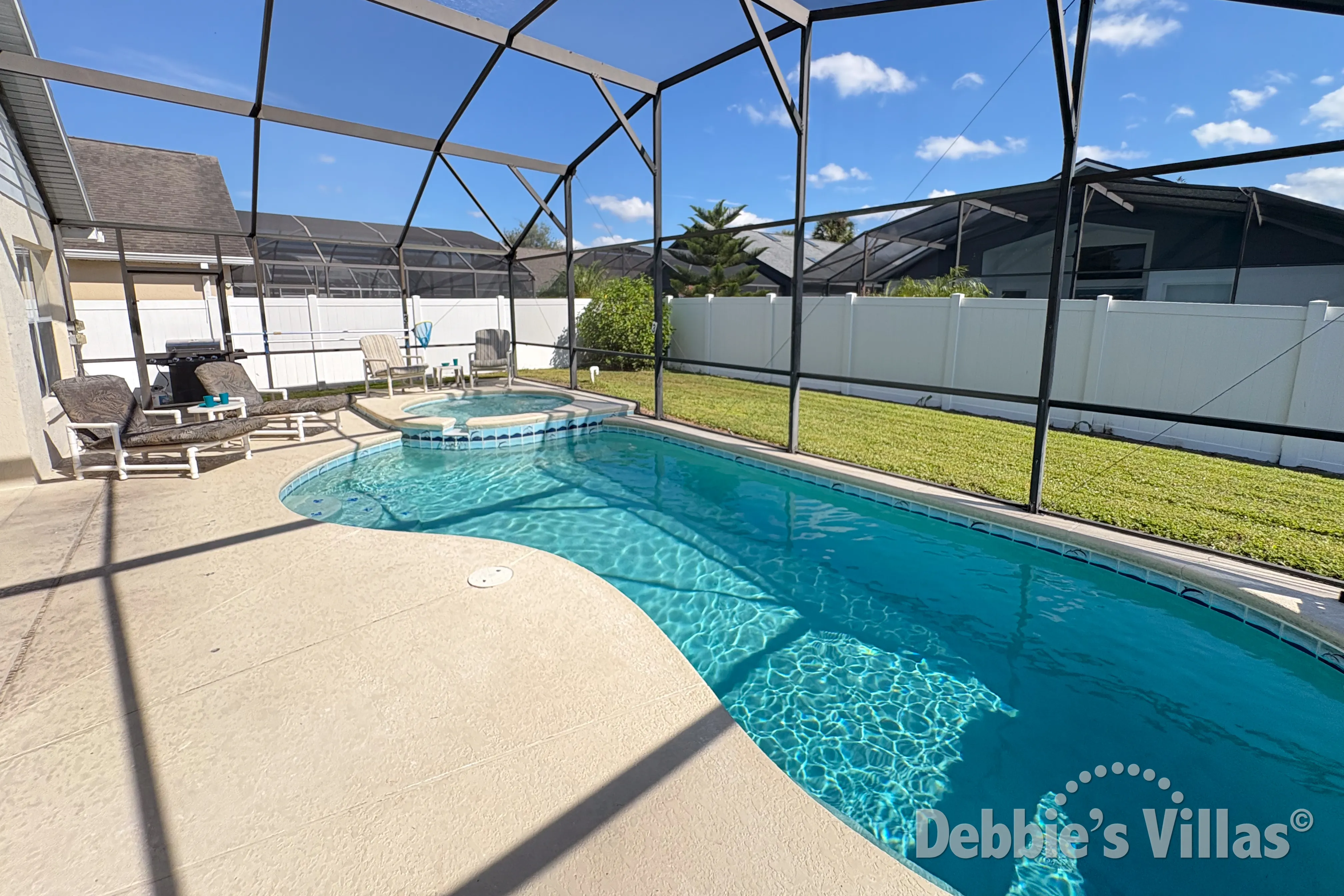 Southeast-facing pool and spa at this vacation villa on Indian Creek in Kissimmee