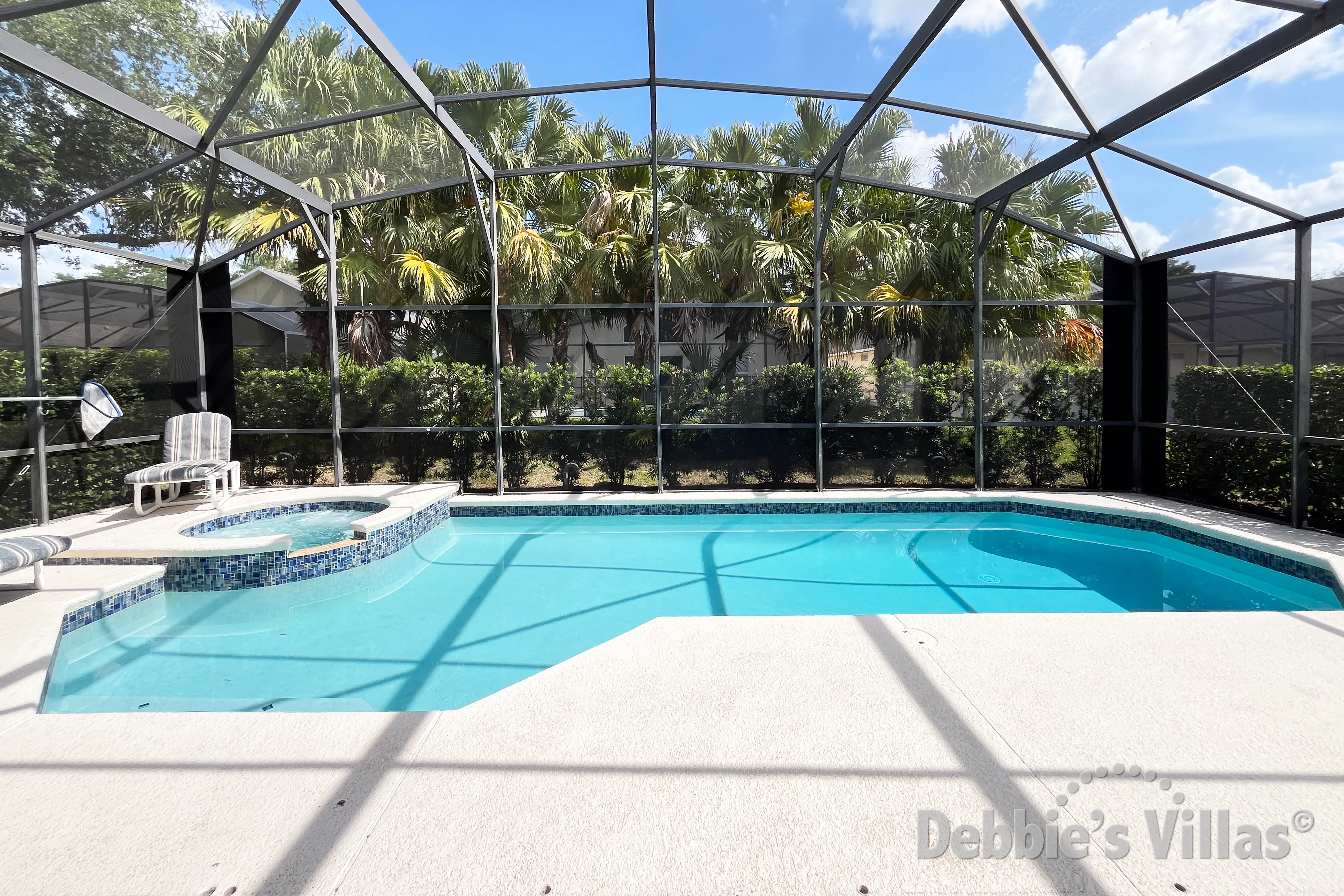 Southeast-facing pool and spa at this vacation villa on Emerald Island in Kissimmee 
