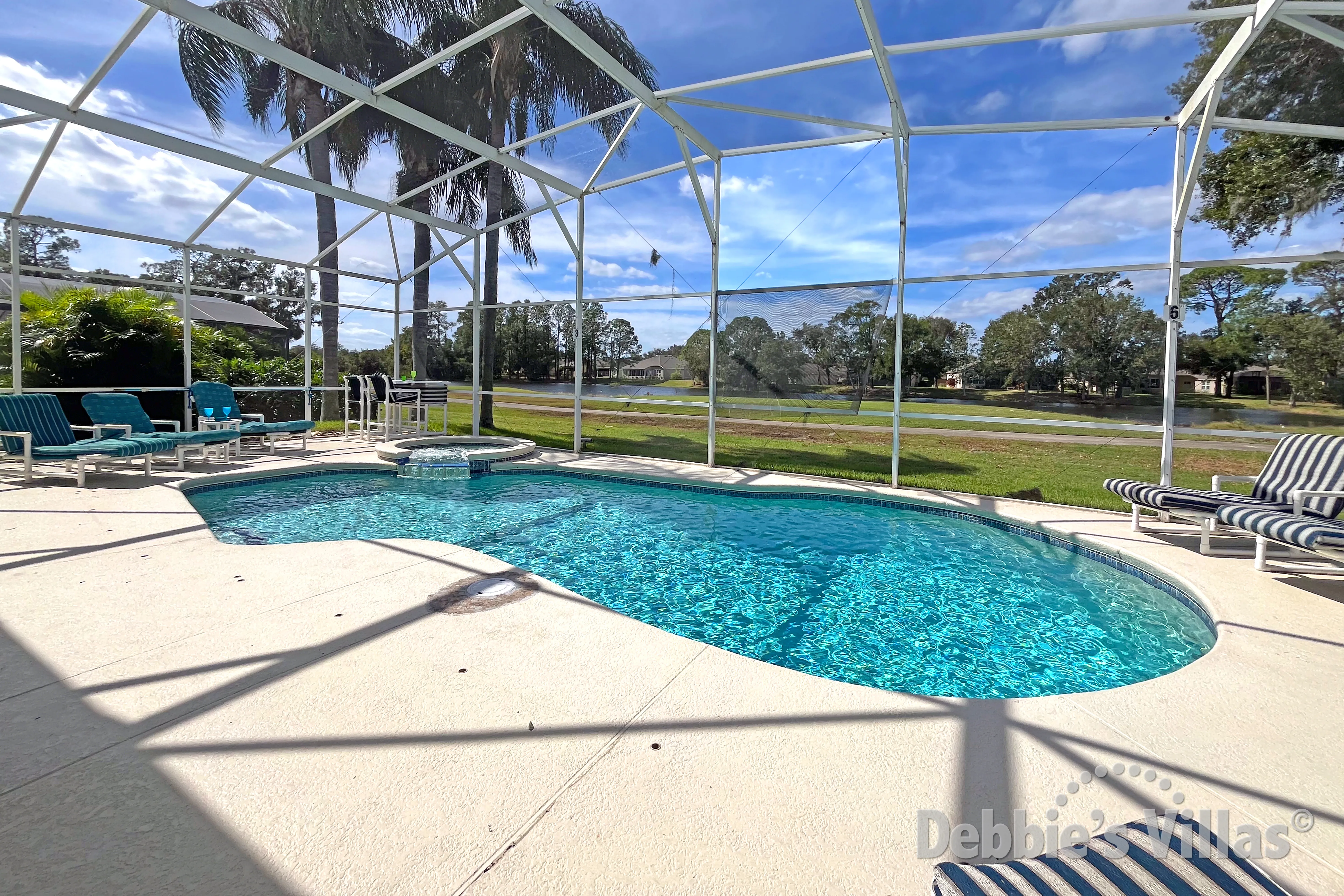 West-facing pool and spa at this vacation villa on Ridgewood Lakes in Davenport