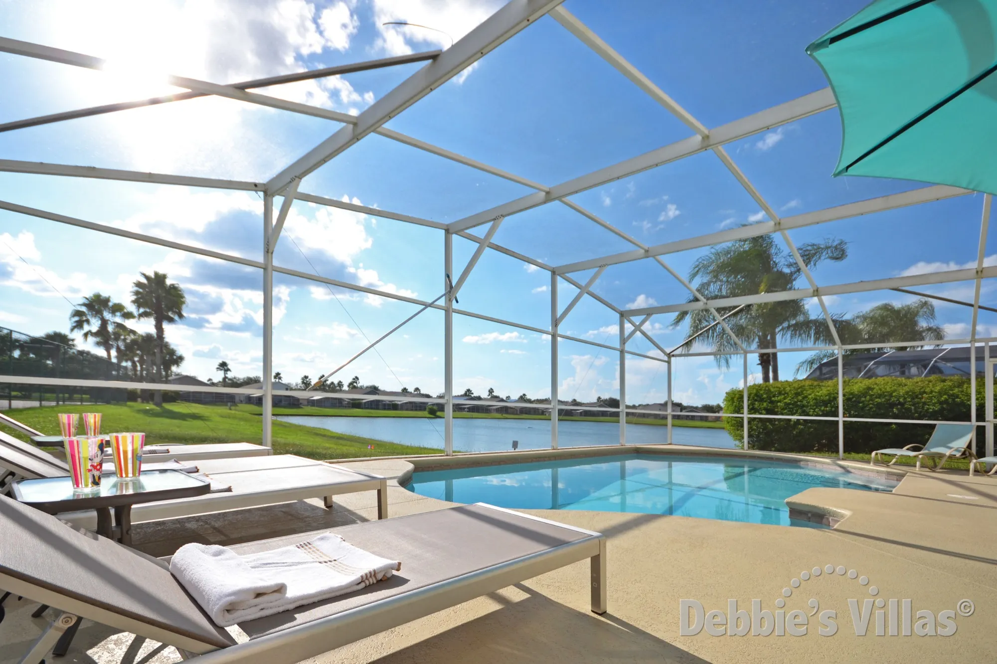 Hampton Lakes villa with a southwest-facing lake view from the private pool