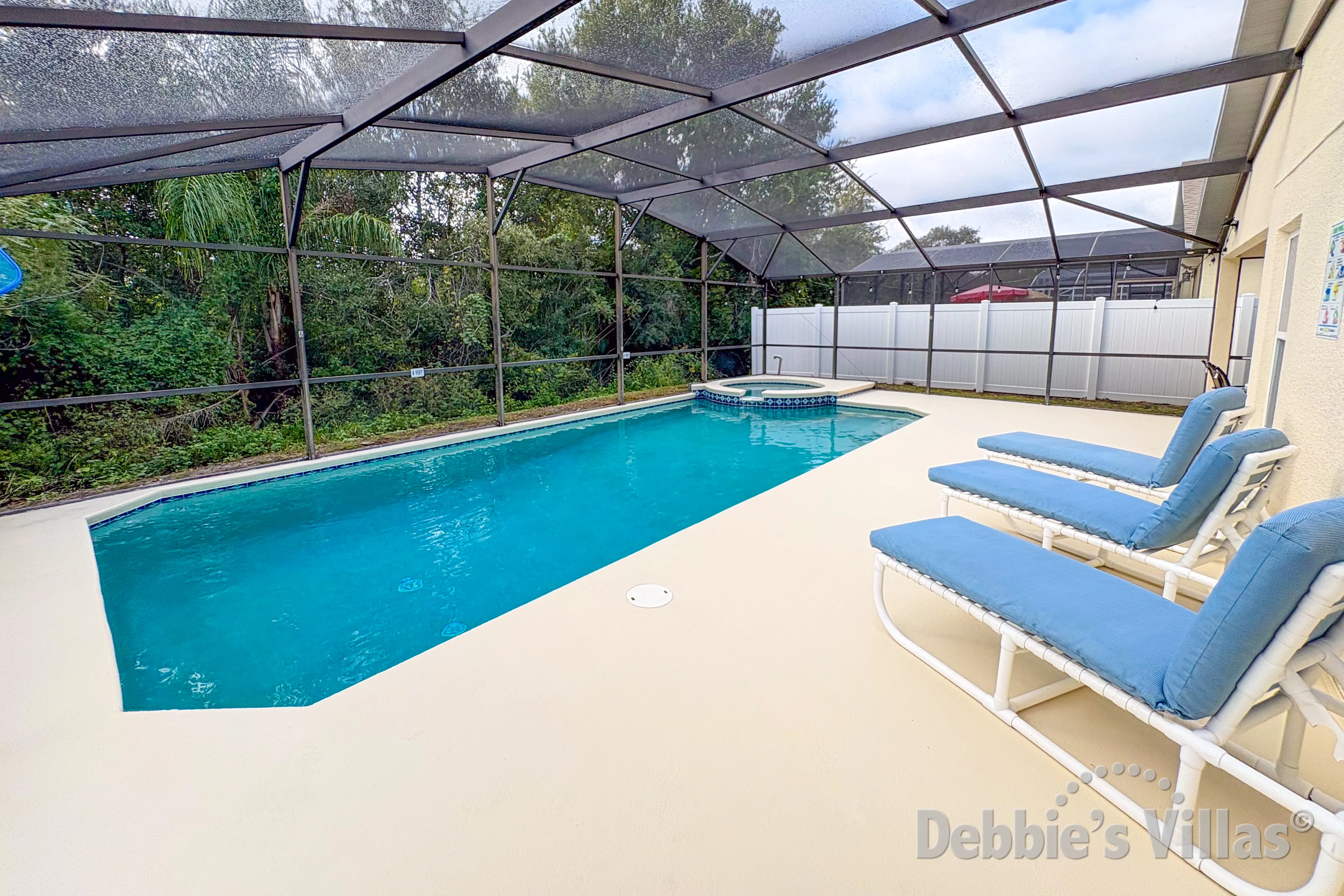 South-facing pool and spa at this vacation villa on Clear Creek in Clermont 