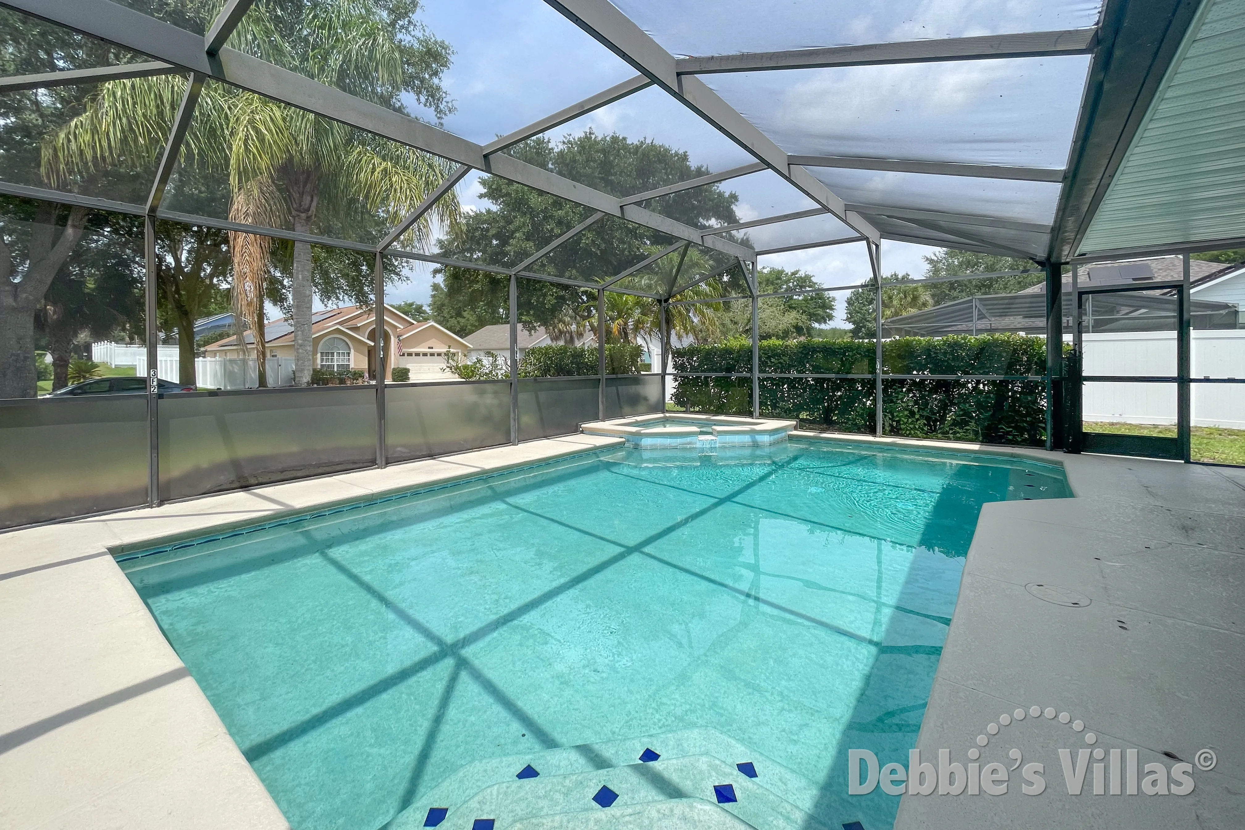 Northwest-facing pool and spa at this vacation villa on Orange Tree in Clermont