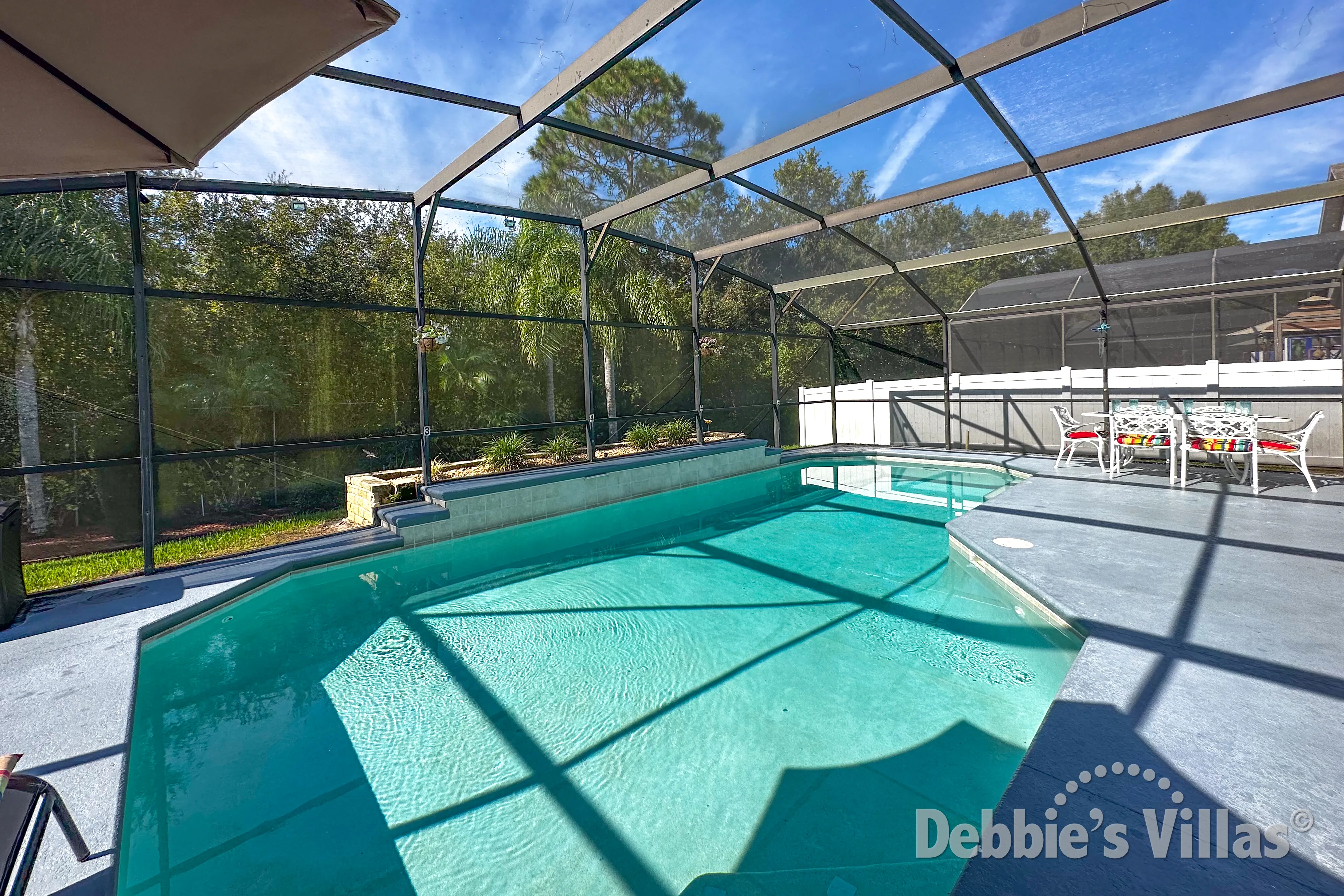 Lake Berkley vacation villa with a sunny west-facing pool deck with woodland view