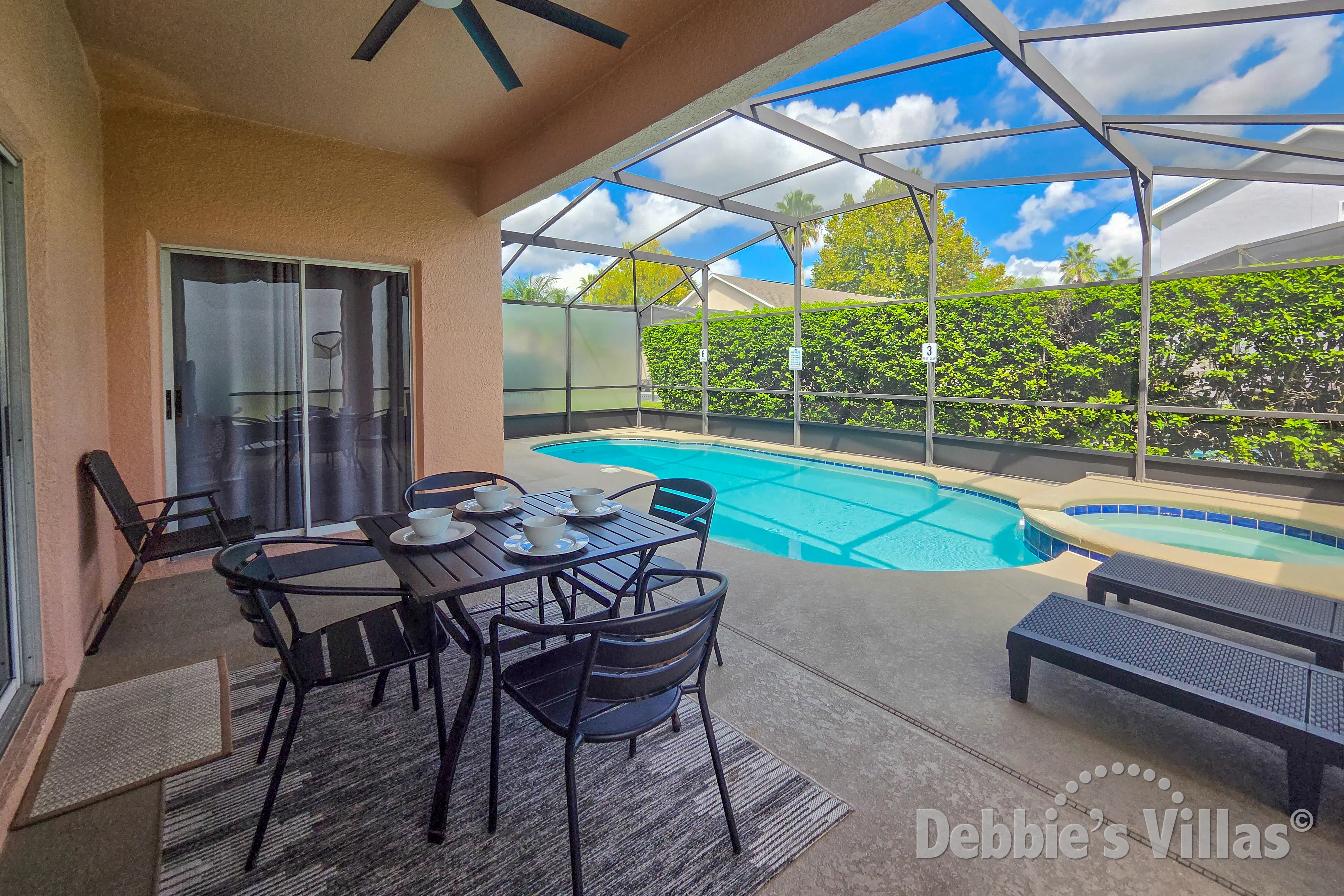 Enjoy an alfresco meal at the covered dining table at the private pool and spa 