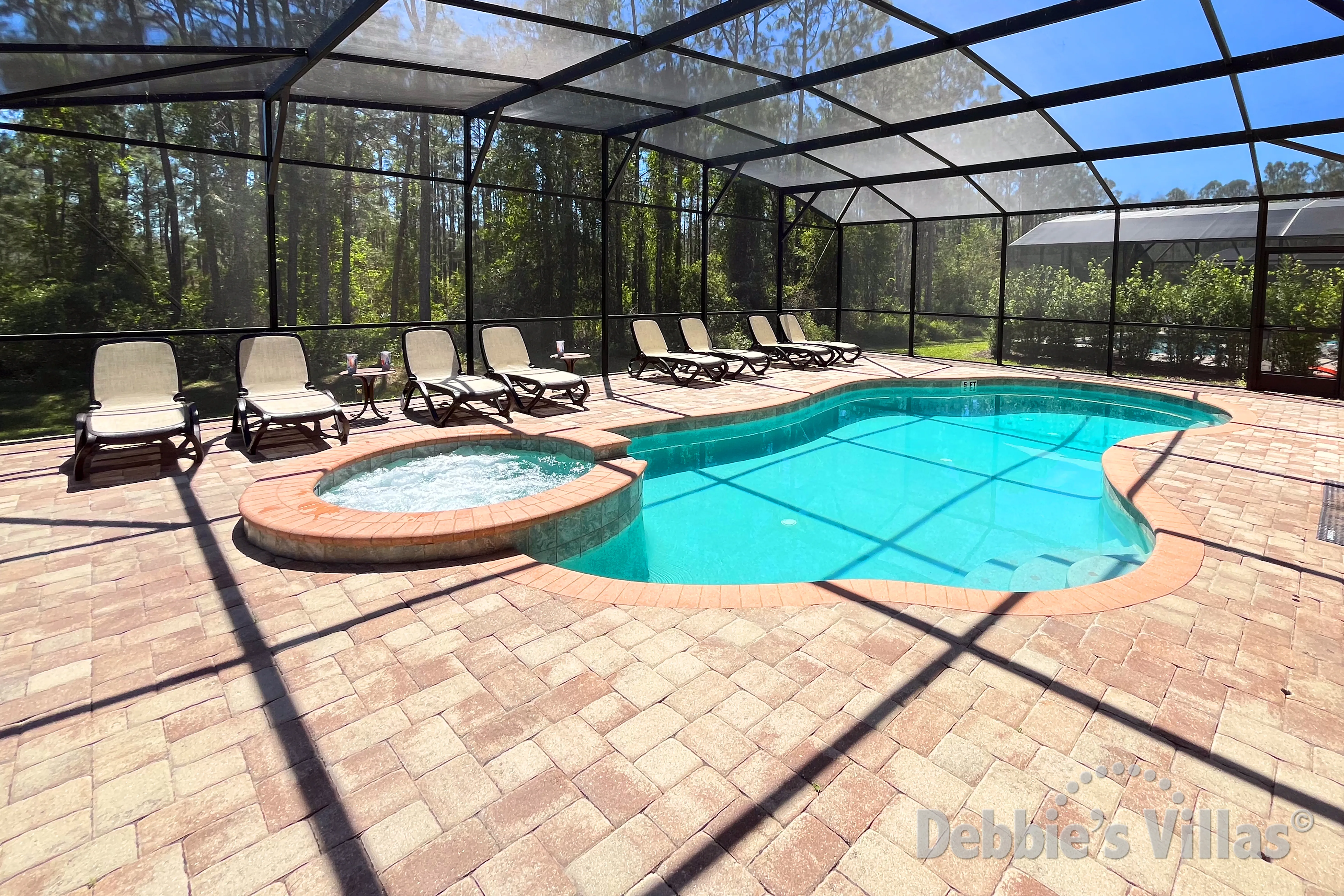 Southeast-facing pool and spa at this vacation villa on Watersong in Davenport