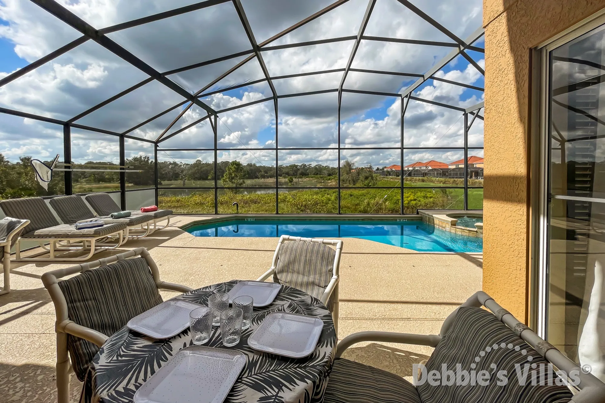 Lake views from the west-facing pool deck of this Aviana villa