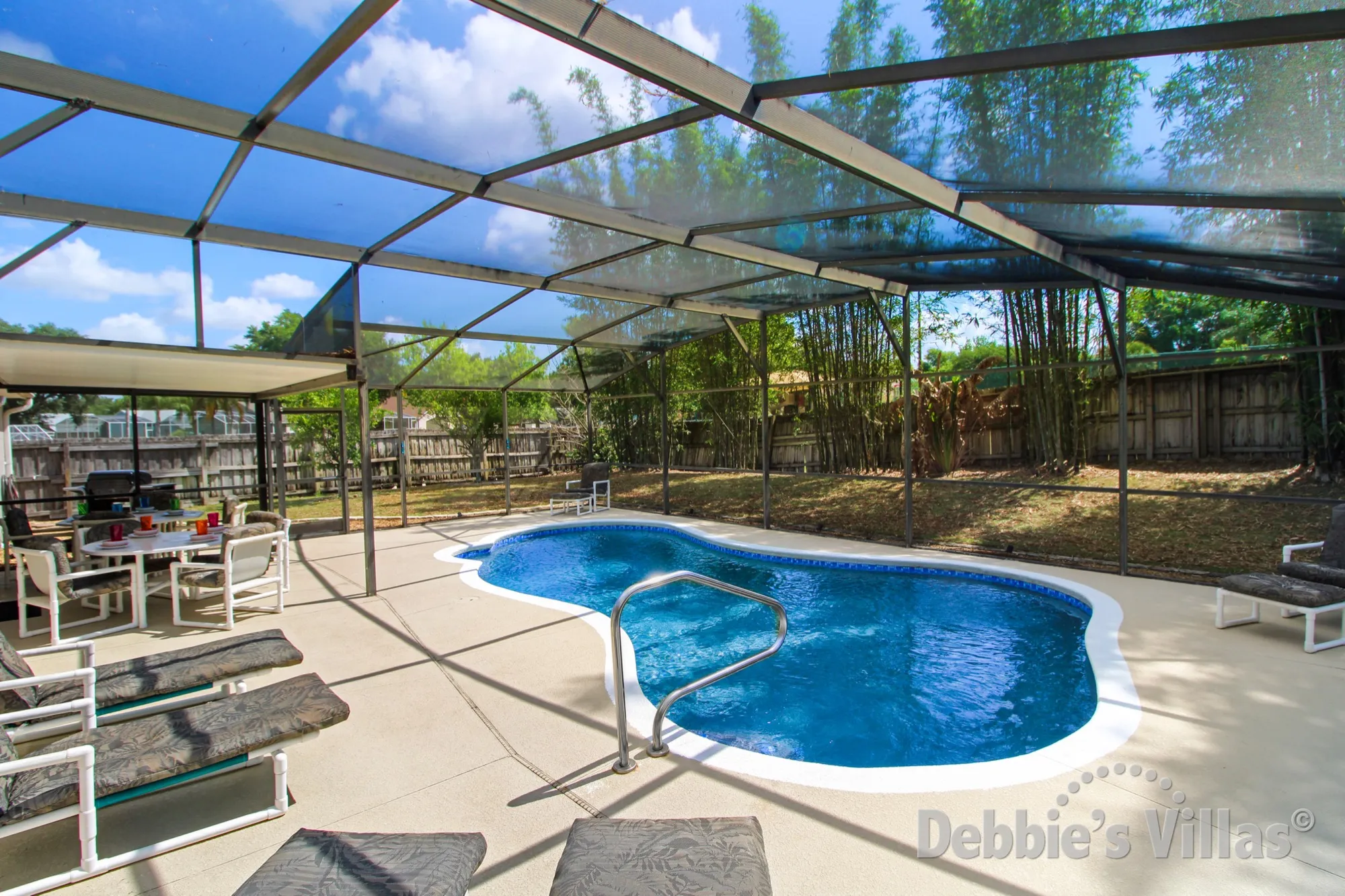 No rear neighbours around the pool at this Westridge villa in Davenport