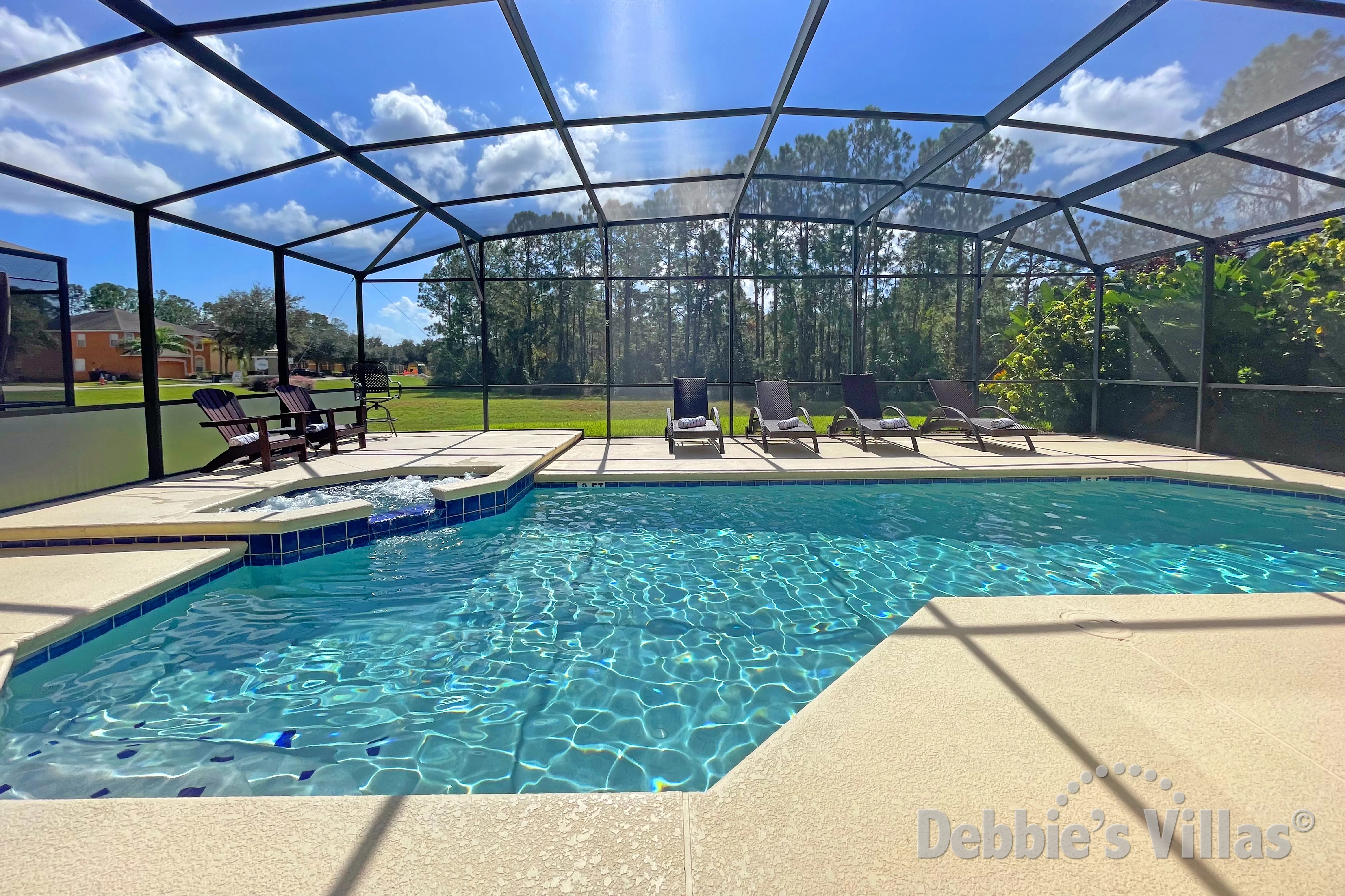 South-facing pool and spa at this vacation villa on Watersong in Davenport