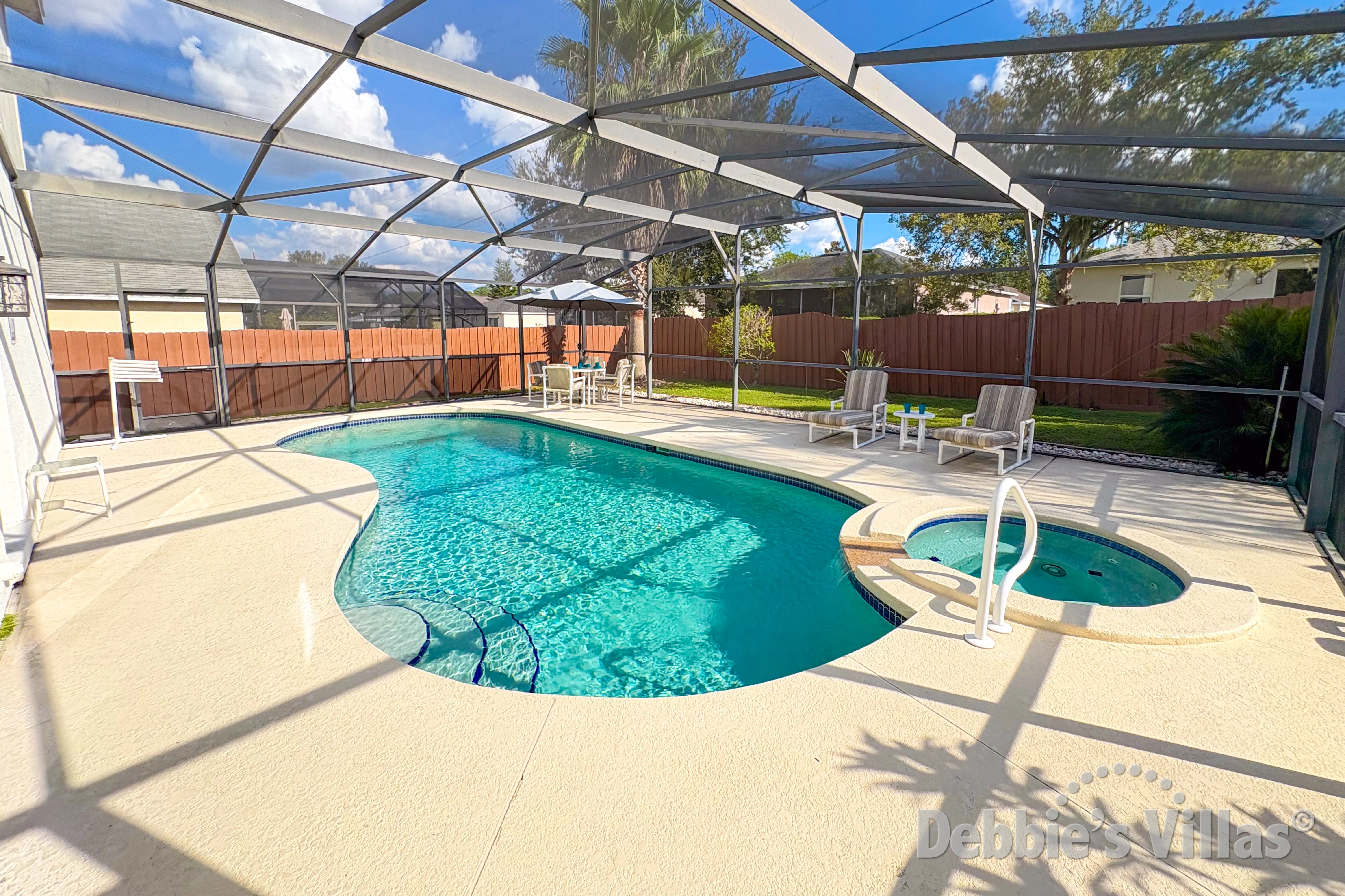South-facing pool and spa at this vacation villa on Davenport Lakes in Davenport 