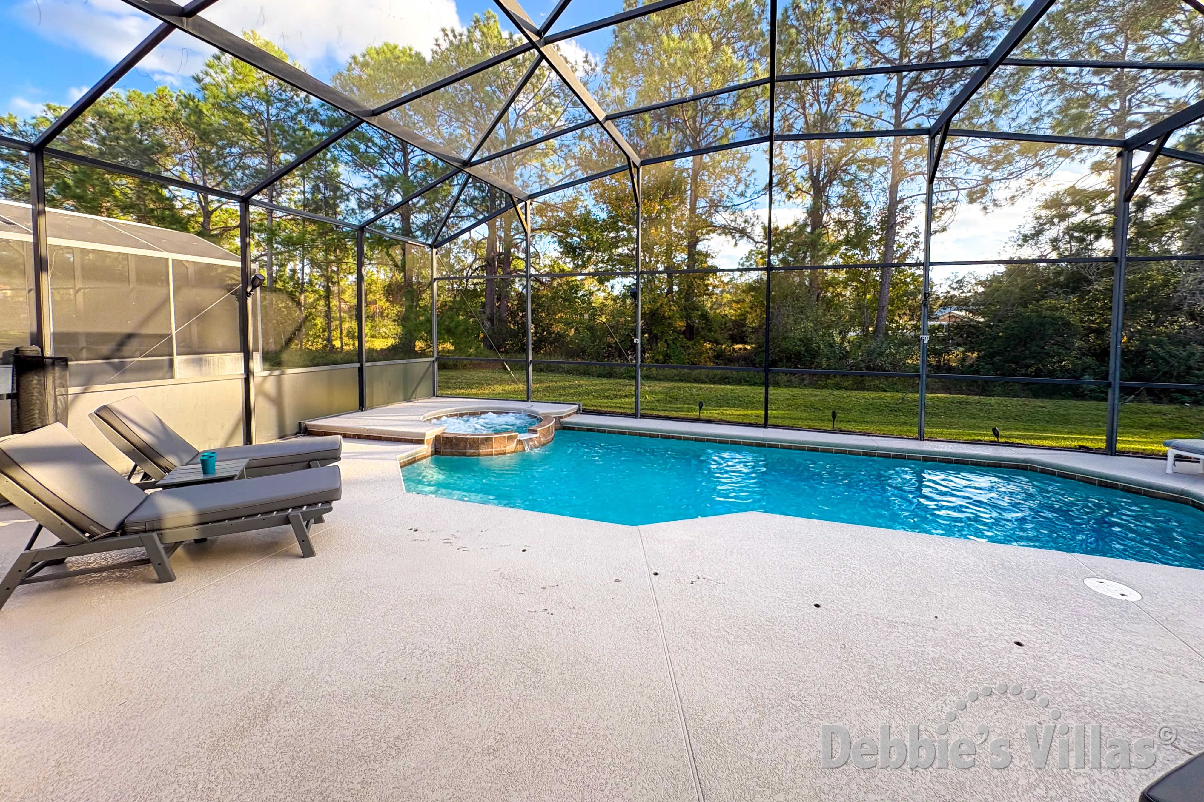 South-facing pool and spa at this vacation villa on Watersong in Davenport