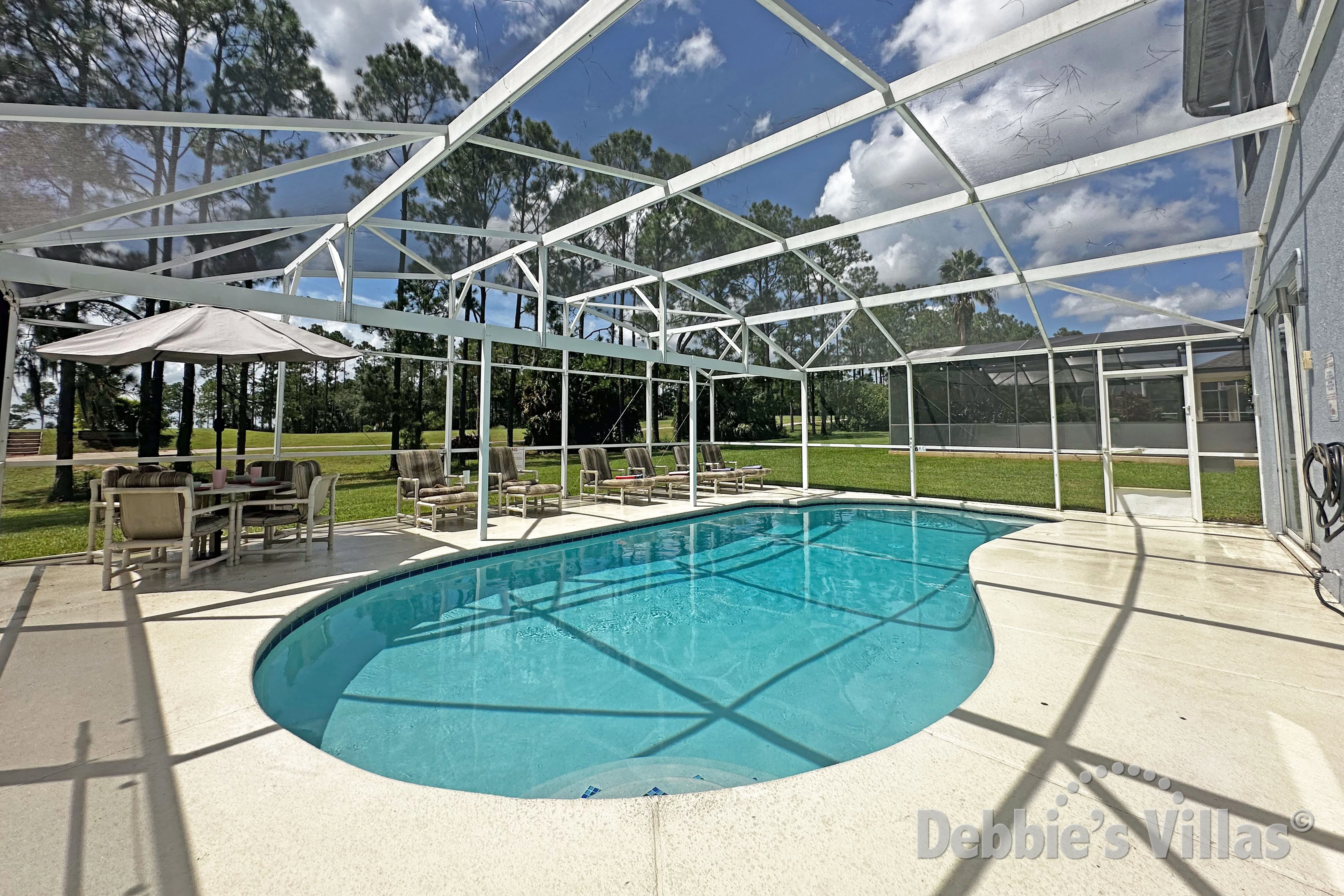 Private west-facing pool deck with scenic views at this vacation villa on Highlands Reserve