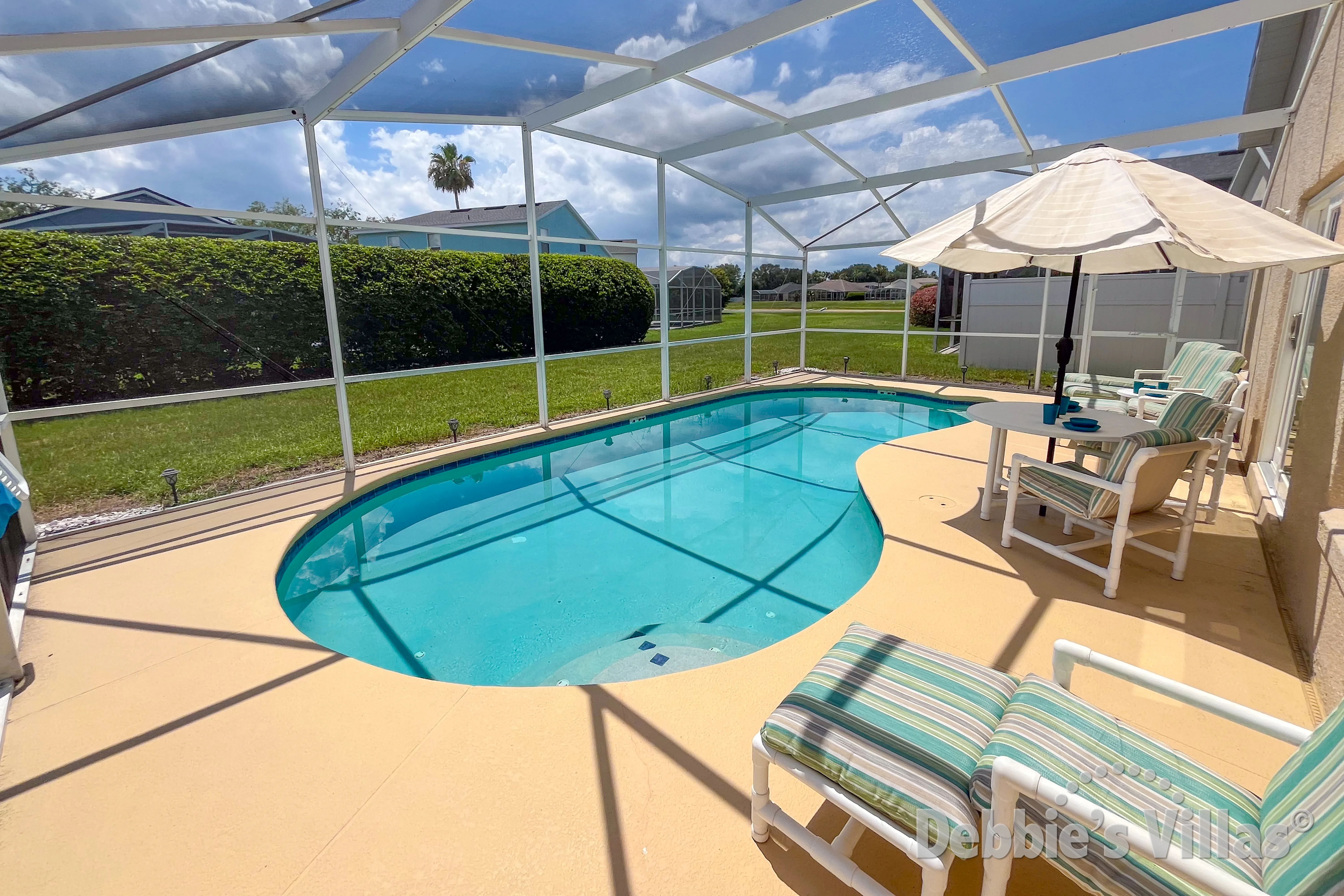West-facing pool and spa at this vacation villa on Hampton Lakes in Davenport 