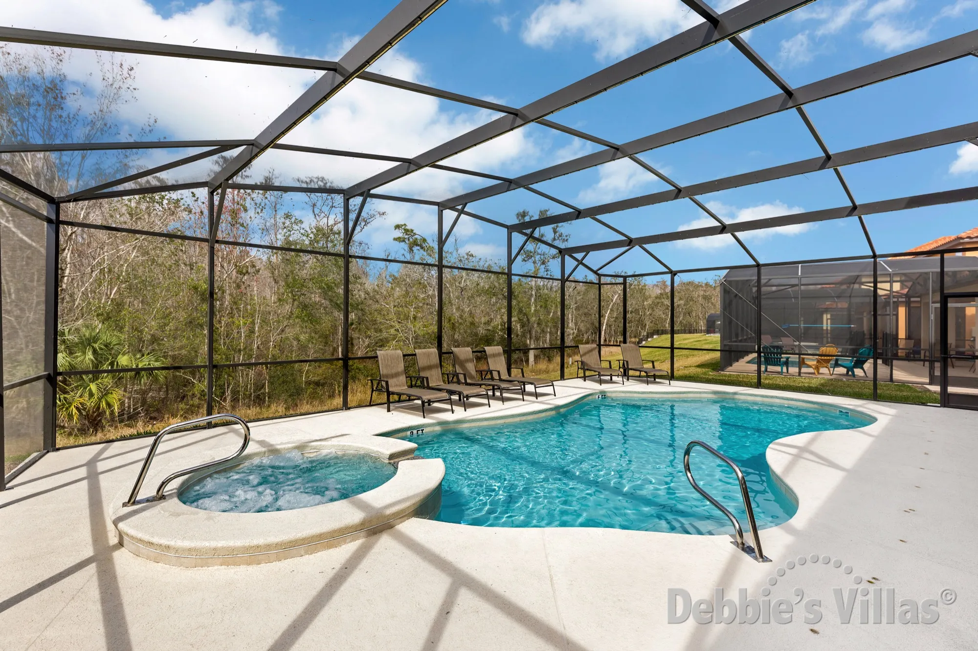 Scenic view from the west-facing private pool and spa at this luxury Kissimmee villa
