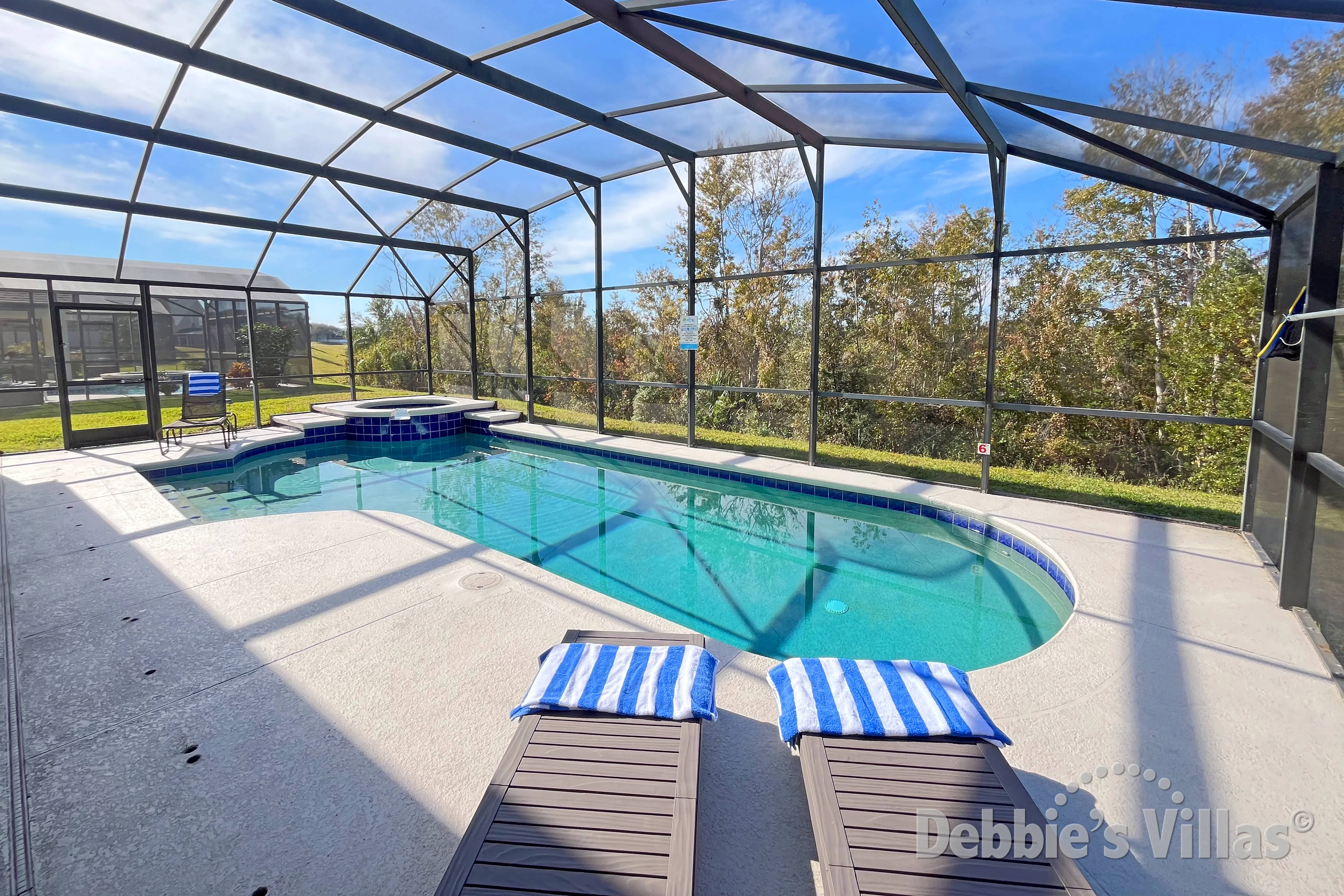 West-facing pool and spa with conservation views at this vacation villa on Weston Hills in Clermont