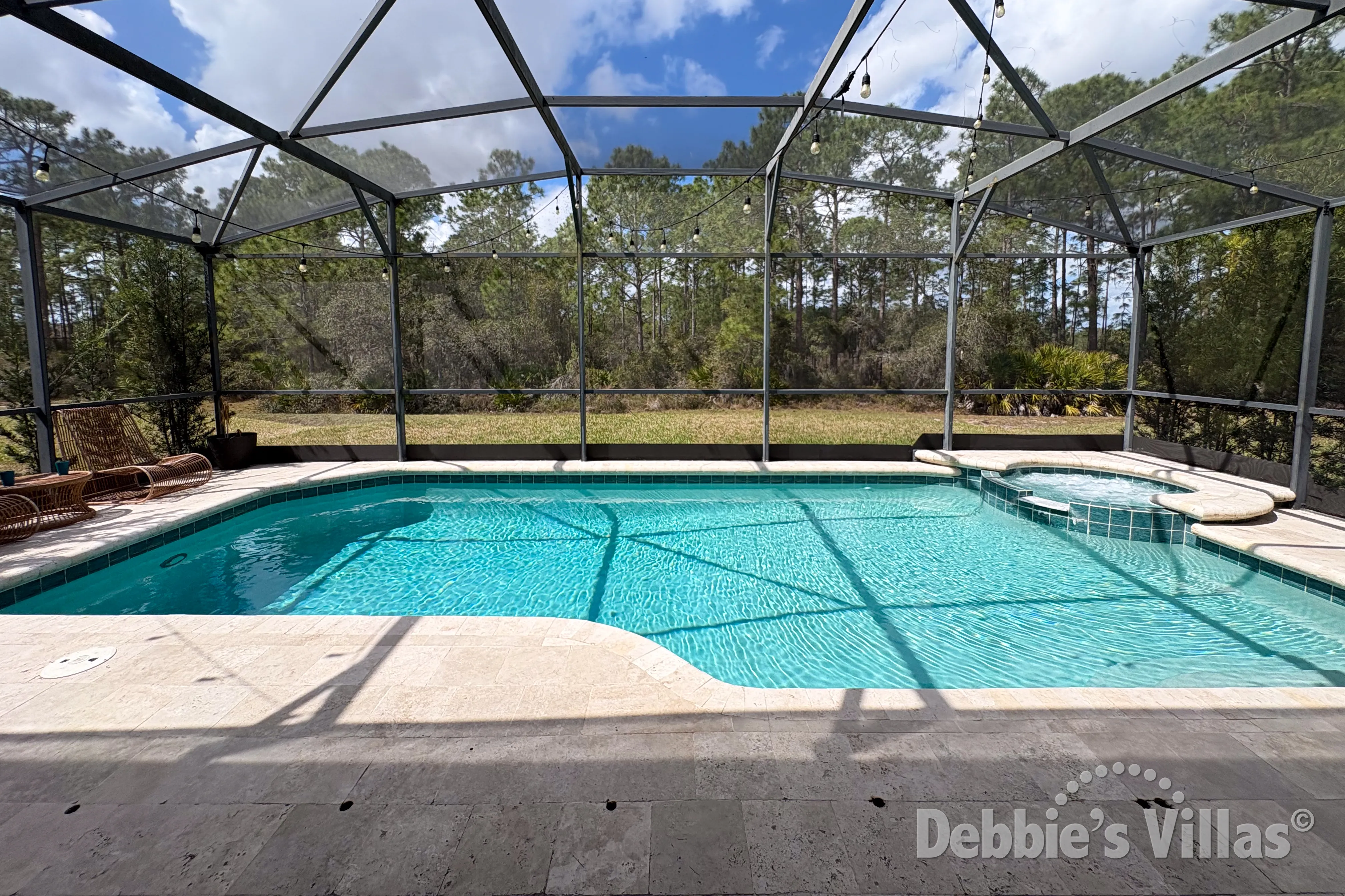 West-facing pool and spa at this vacation villa on Watersong in Davenport