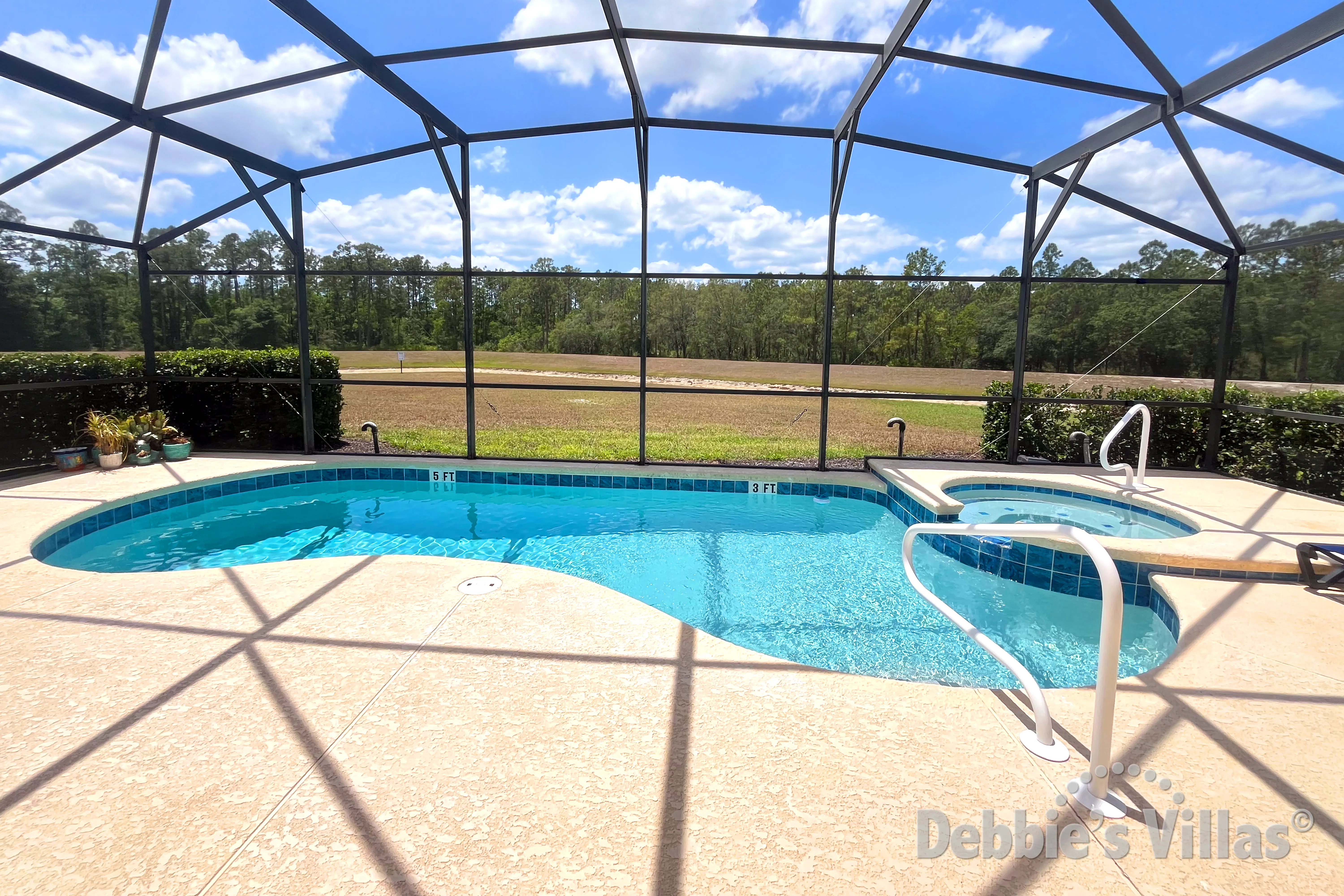 Southwest-facing pool and spa at this vacation villa on Emerald Island in Kissimmee 