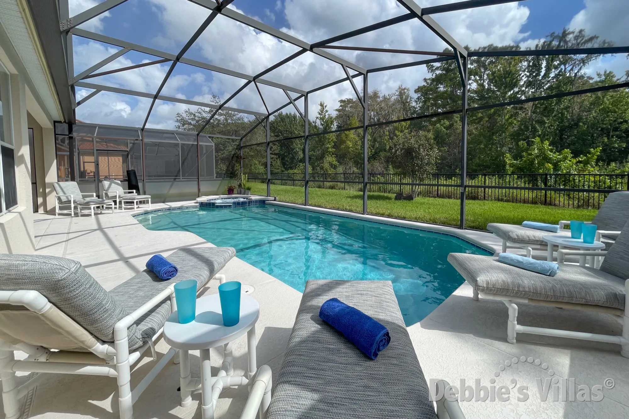 Relax and enjoy the scenic view from this south-facing pool deck of this Bella Vida vacation villa