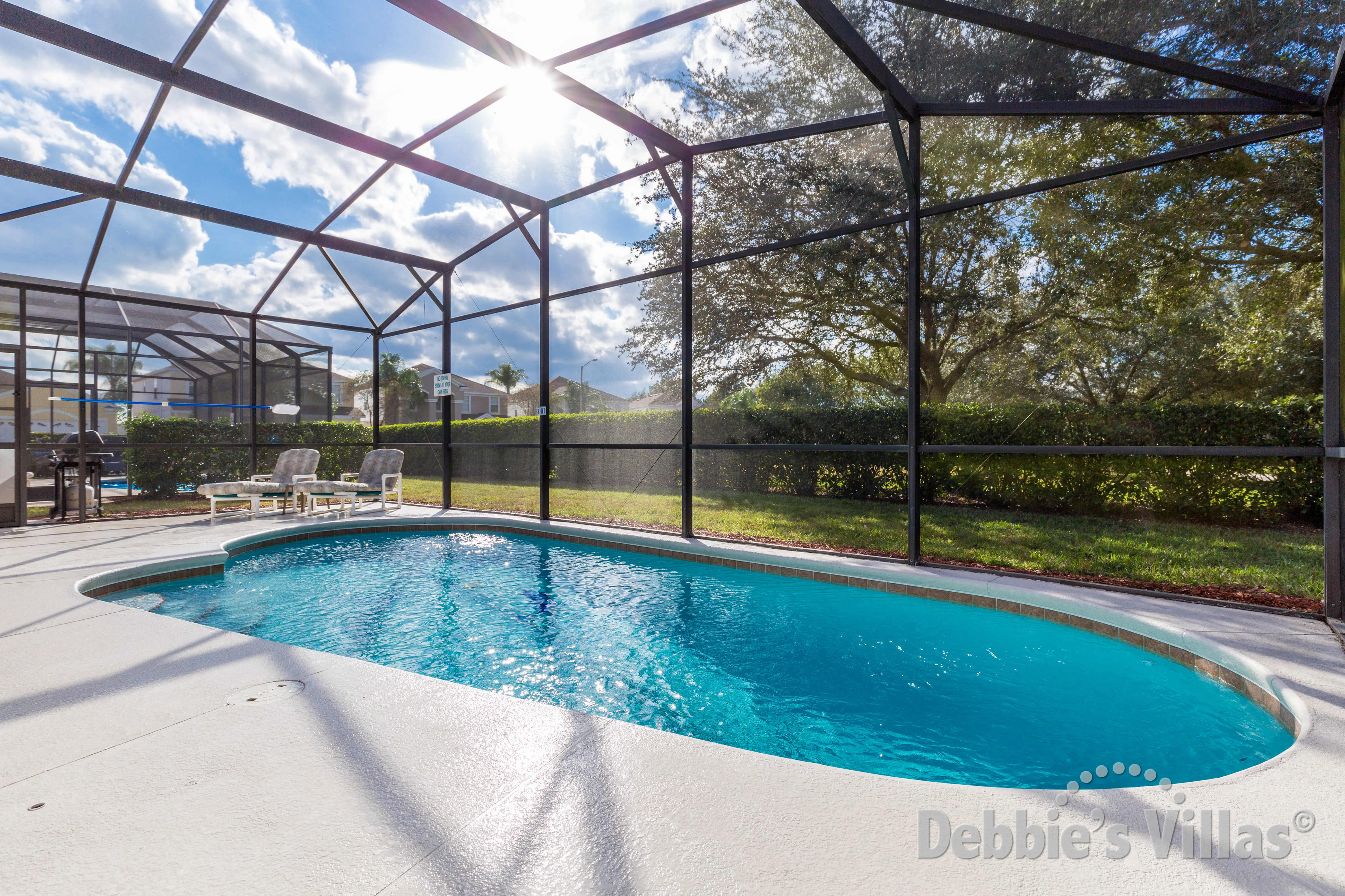Sunny pool deck at this Kissimmee vacation villa