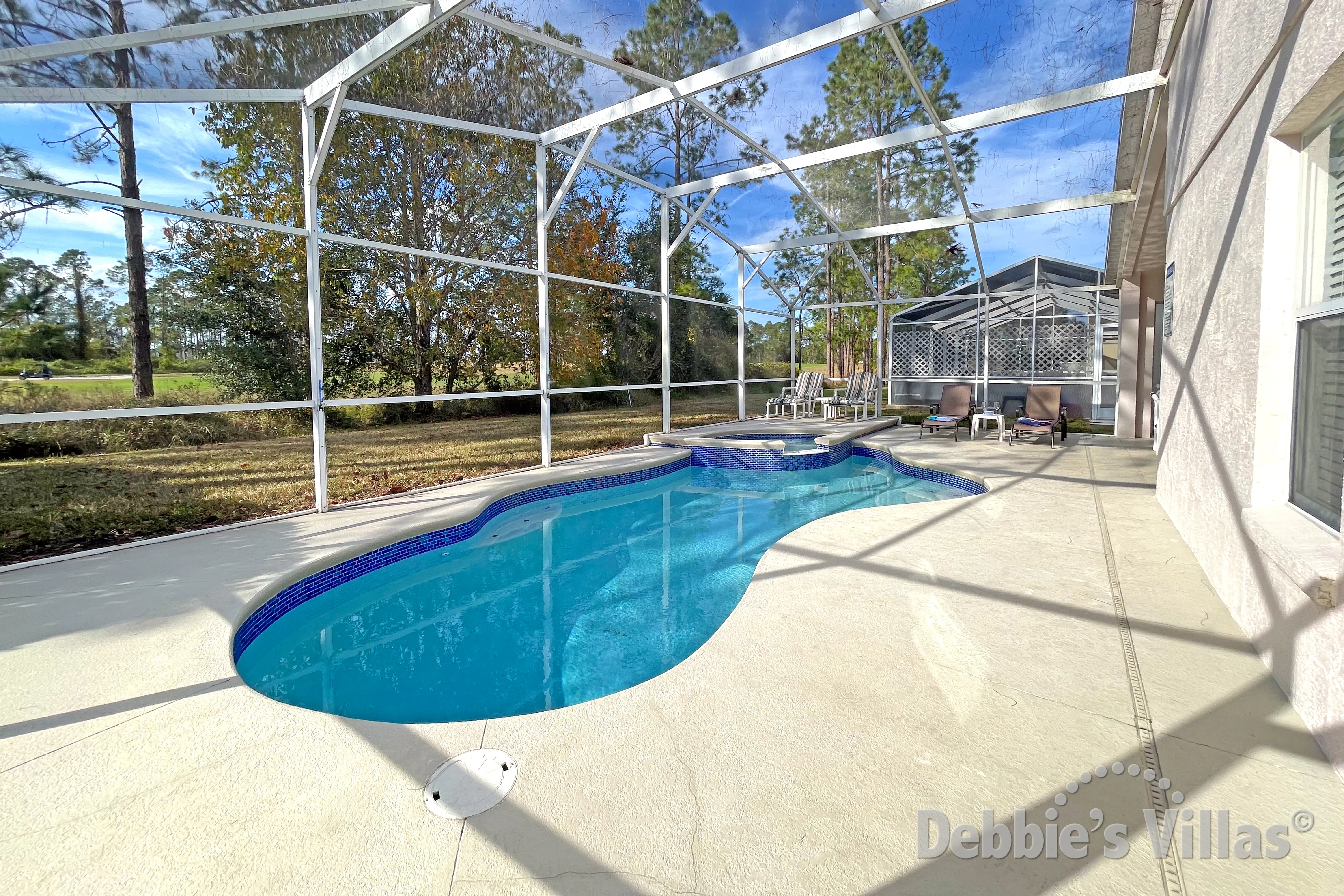 West-facing pool and spa at this vacation villa on Highlands Reserve in Davenport
