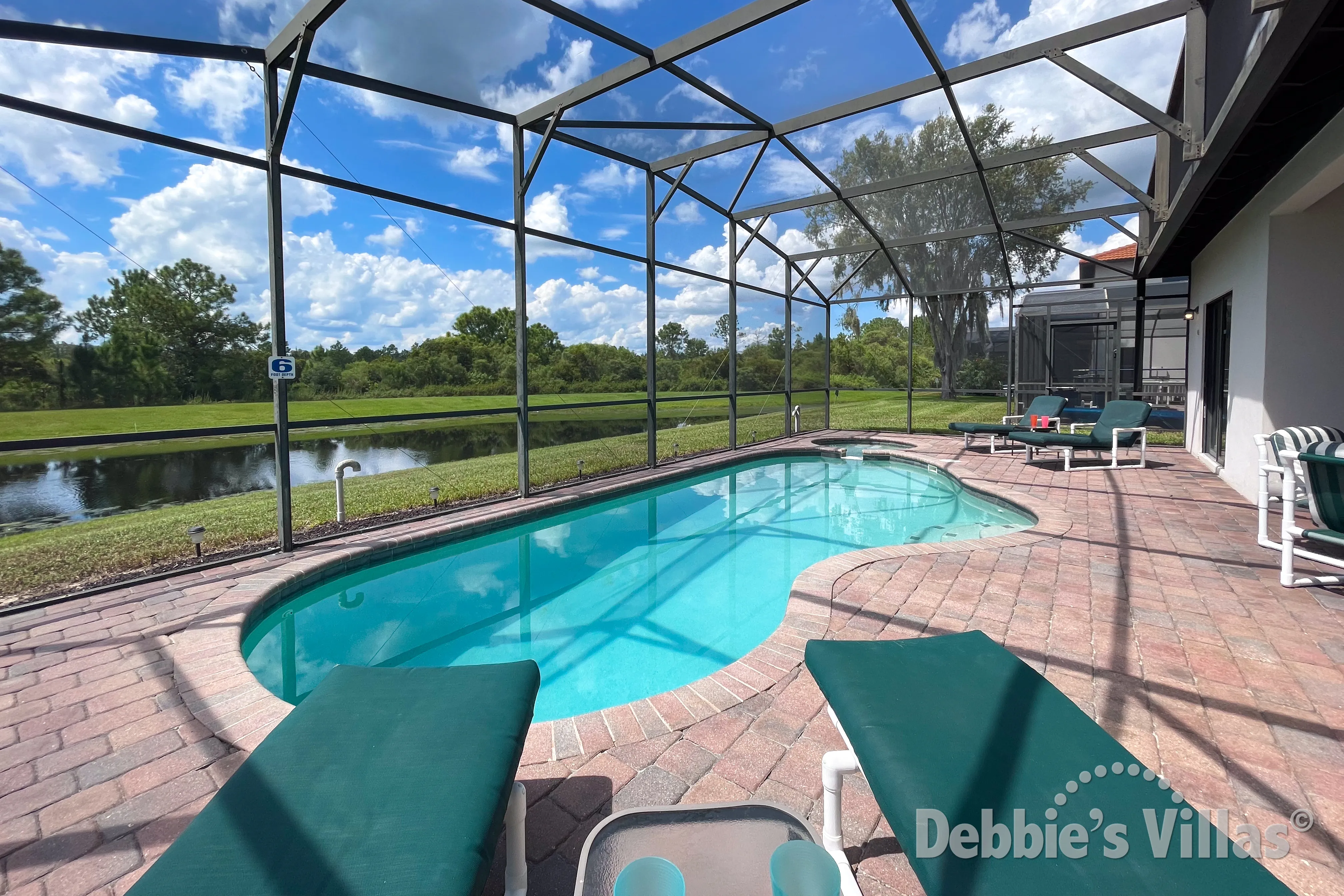 Stunning lake views from the west-facing pool and spa deck at this Clermont vacation villa