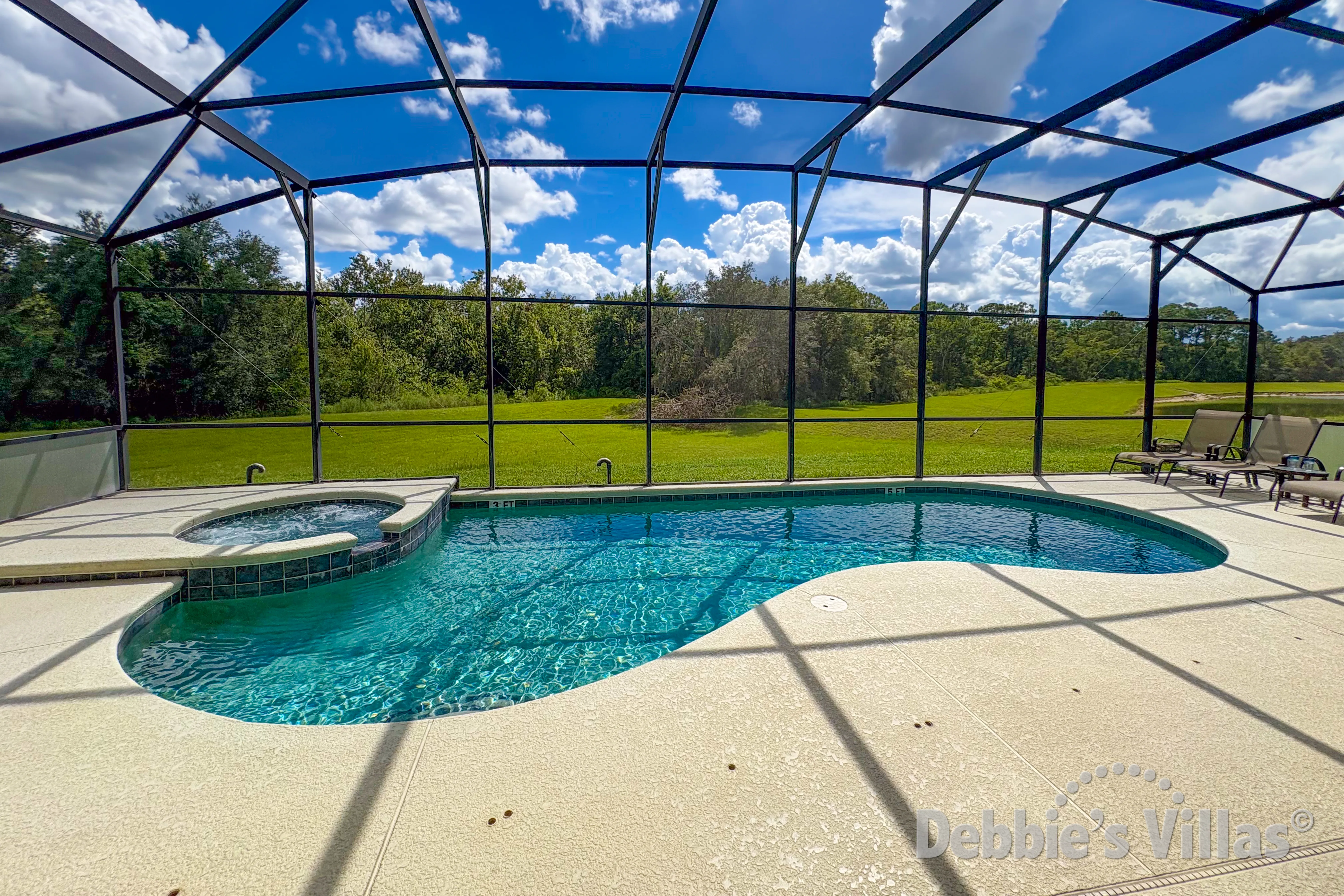 Southwest-facing pool and spa at this vacation villa on Emerald Island in Kissimmee